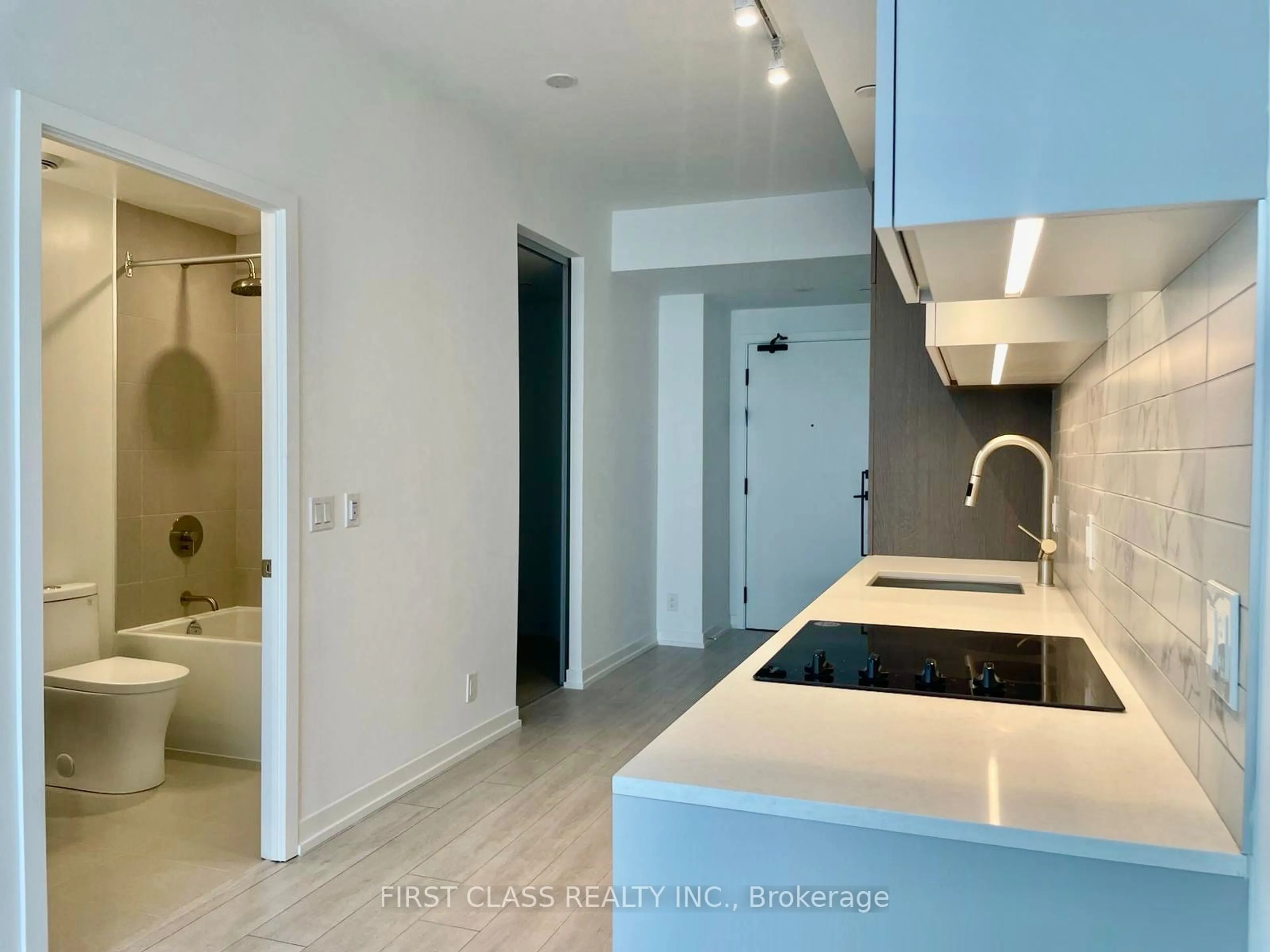 Kitchen with laundary machines, ceramic floors for 55 Mercer St #3215, Toronto Ontario M5V 3W2