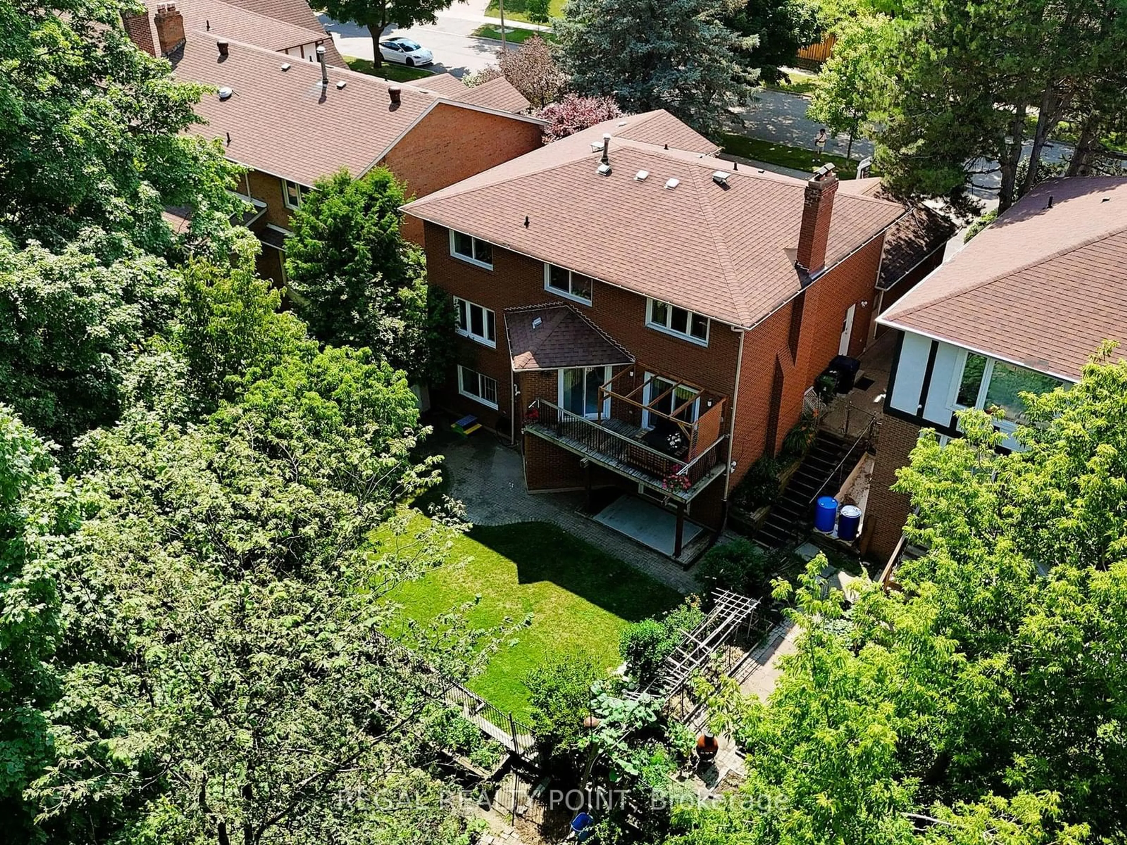 Frontside or backside of a home, the fenced backyard for 27 Bluffwood Dr, Toronto Ontario M2H 3L4