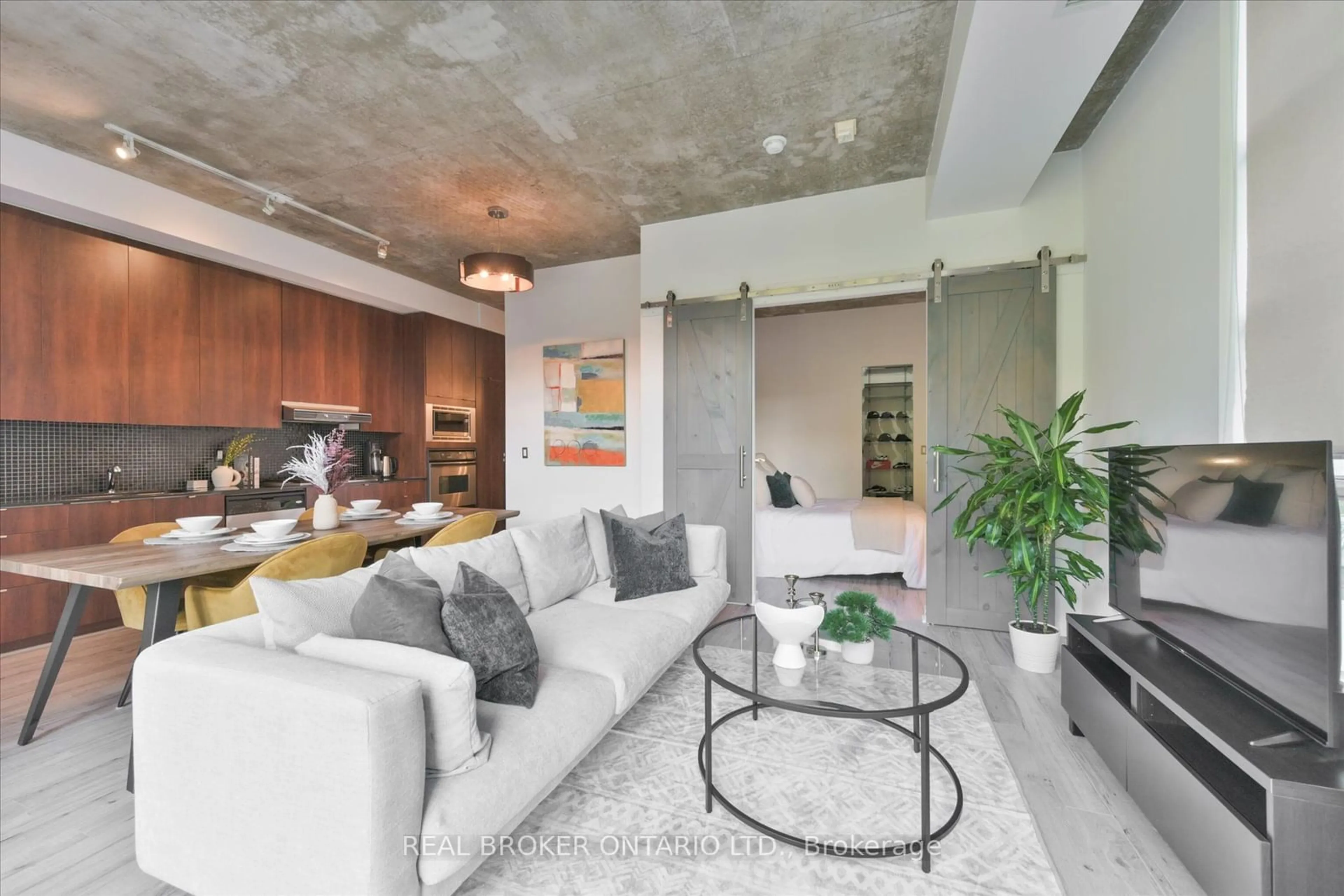 Living room, cement floor for 23 Brant St #305, Toronto Ontario M5V 2L5