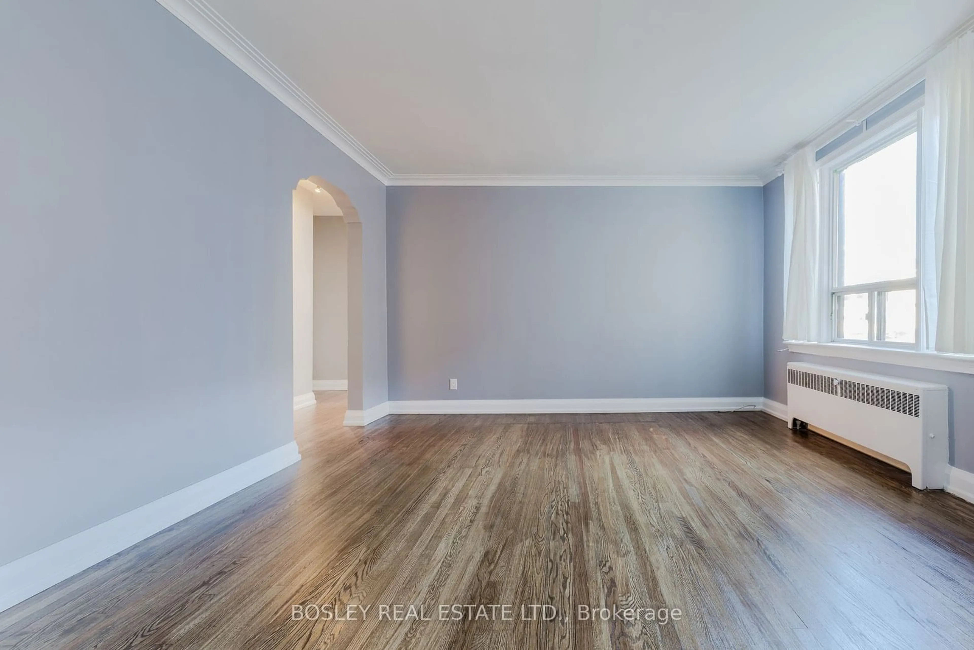 A pic of a room, wood floors for 7 Warwick Ave #2, Toronto Ontario M6C 1T5