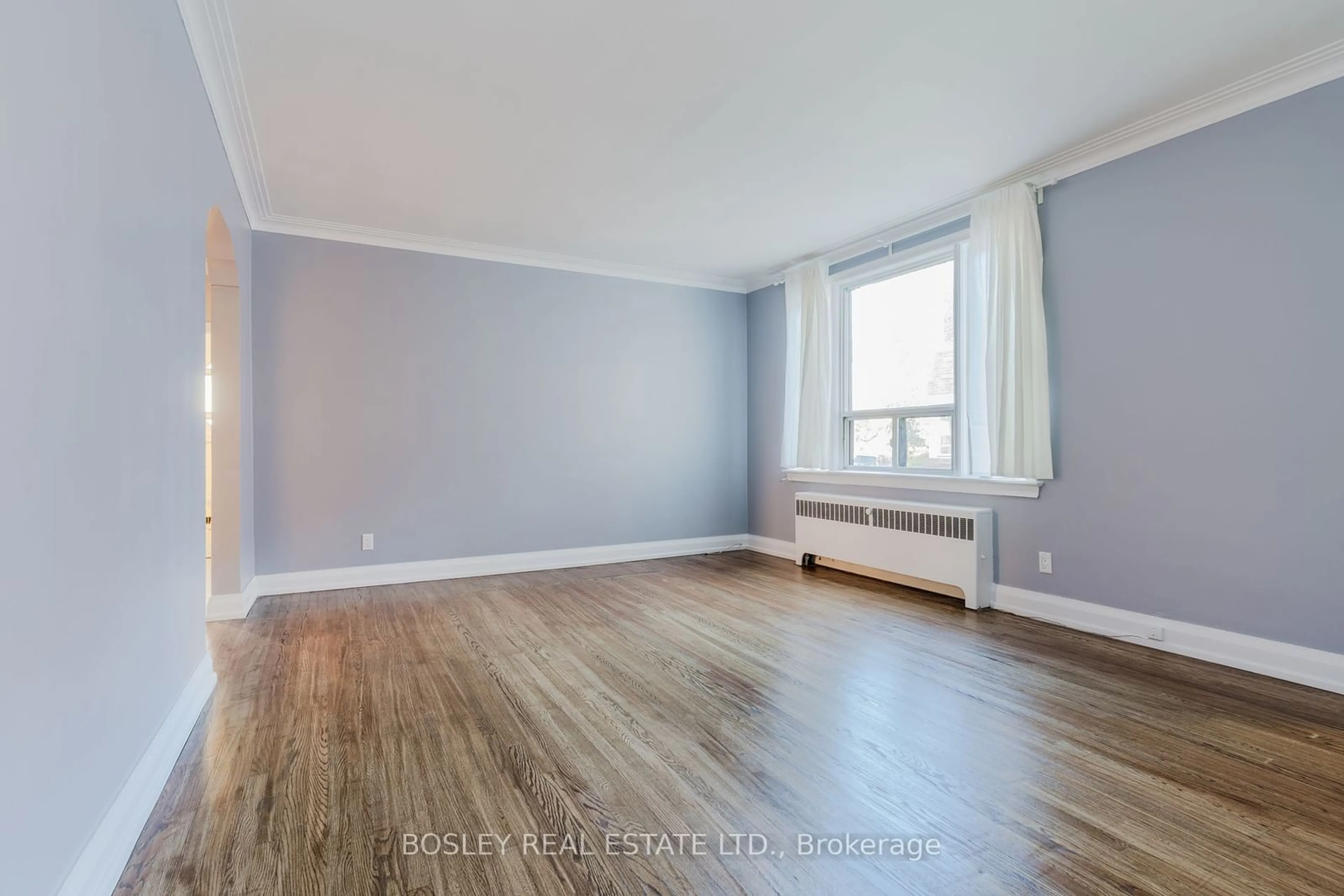 A pic of a room, wood floors for 7 Warwick Ave #2, Toronto Ontario M6C 1T5