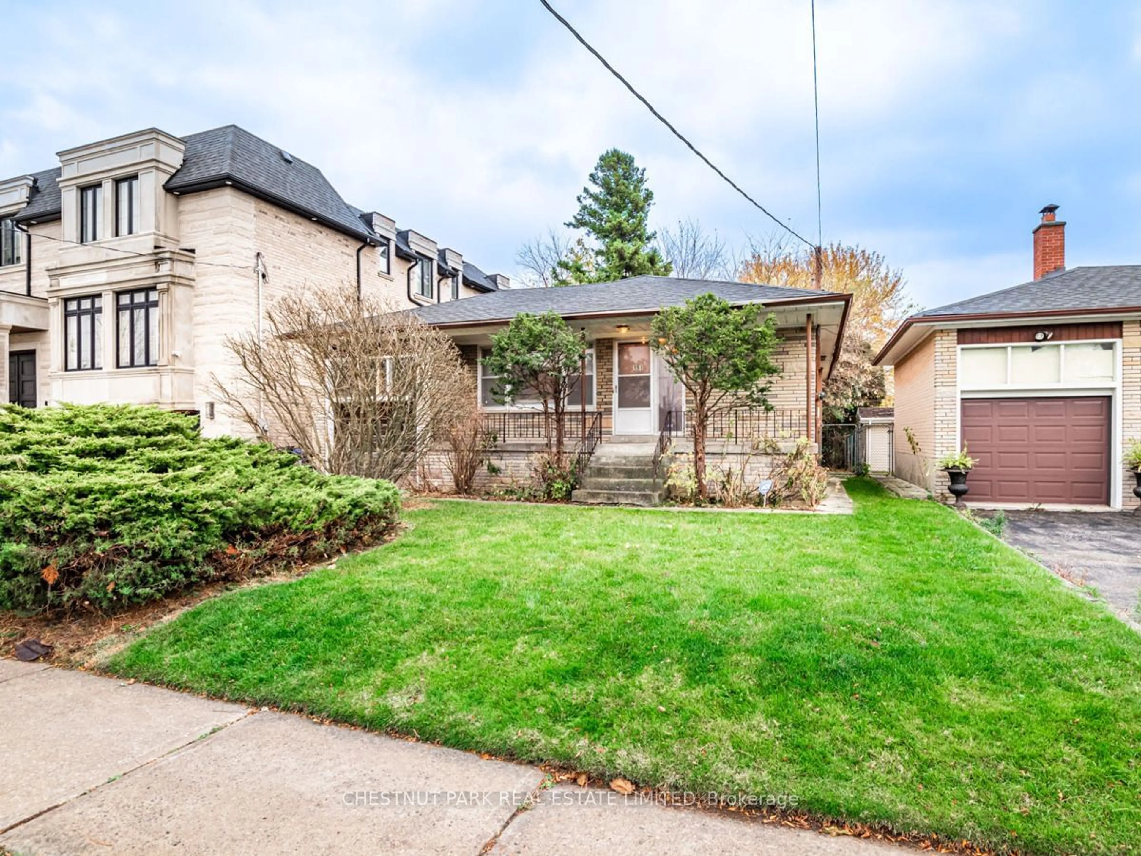 Frontside or backside of a home, the fenced backyard for 151 Alexis Blvd, Toronto Ontario M3H 2R1