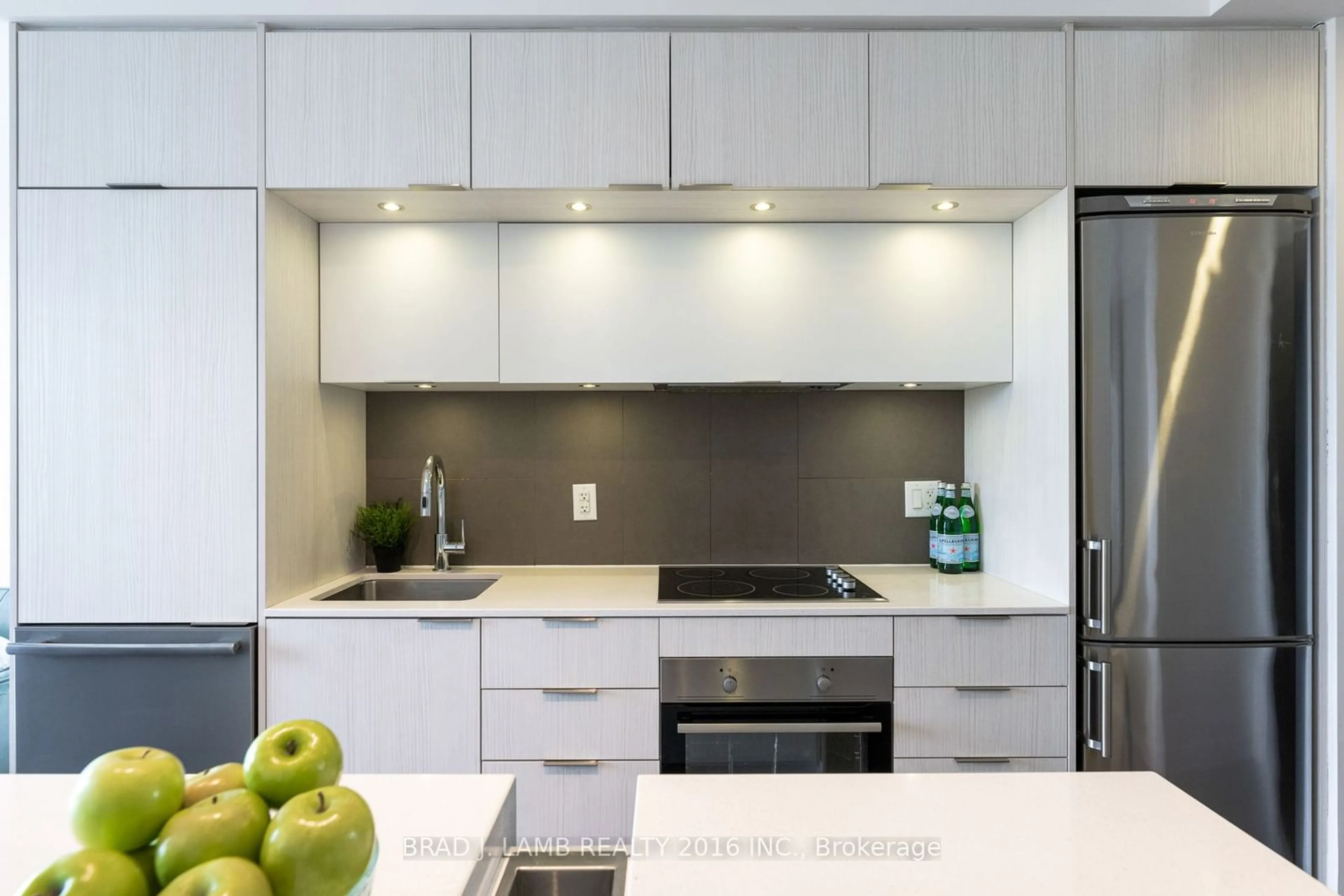 Contemporary kitchen, wood floors for 55 Regent Park Blvd #2110, Toronto Ontario M5A 0C2