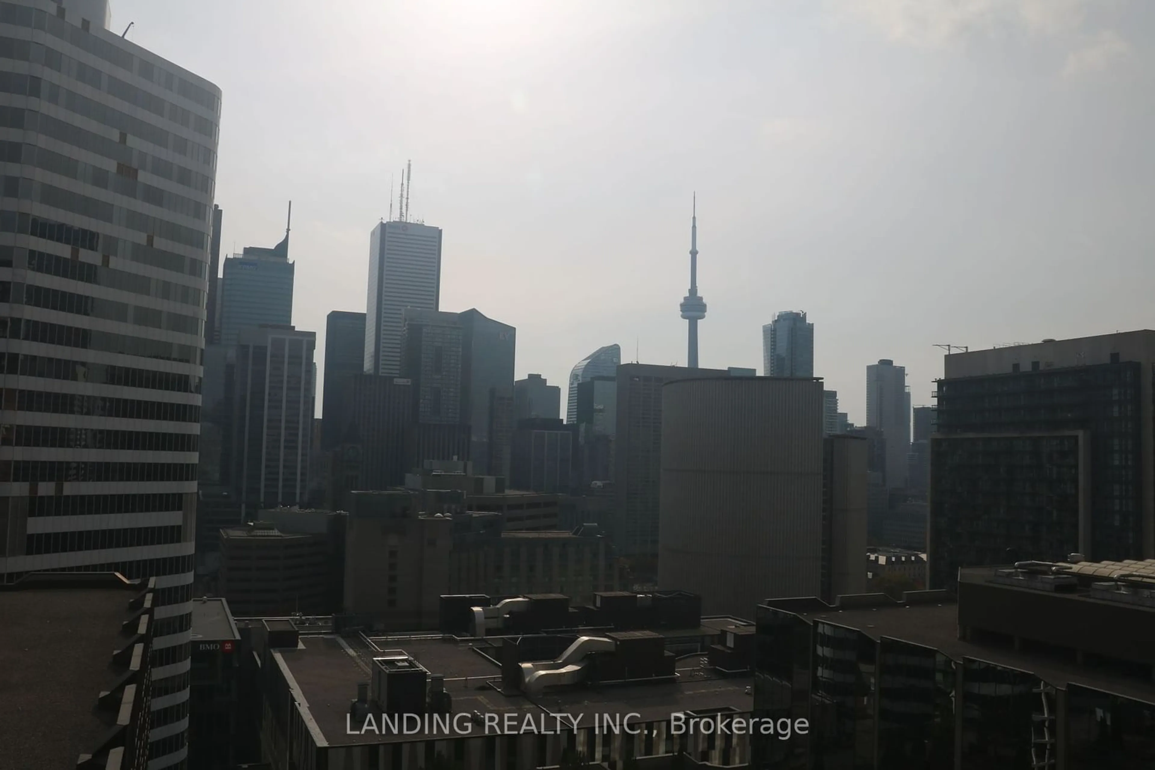 A pic from exterior of the house or condo, the view of city buildings for 20 Edward St #1910, Toronto Ontario M5G 0C5