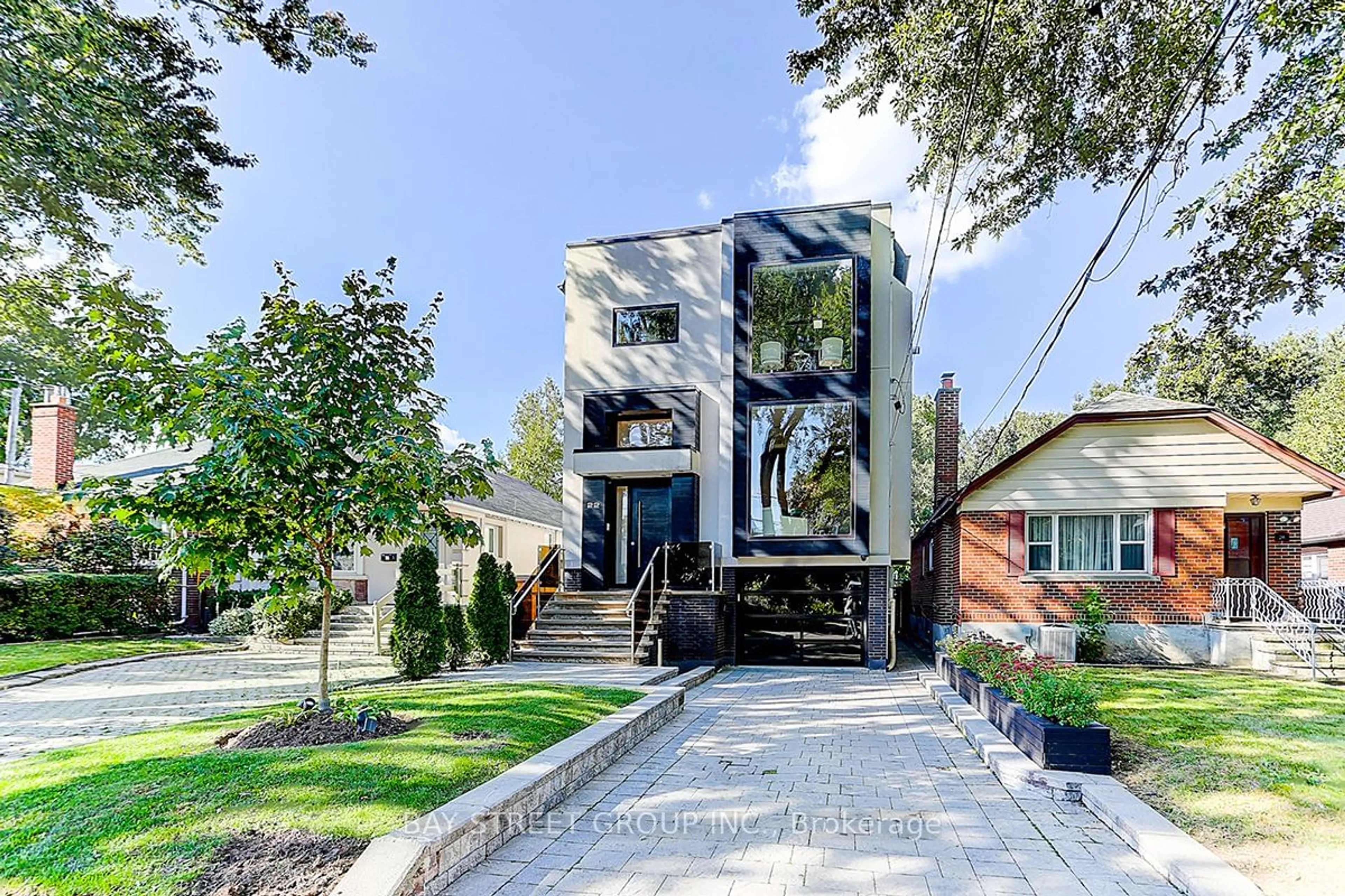 Frontside or backside of a home, the street view for 22 Carmichael Ave, Toronto Ontario M5M 2W6