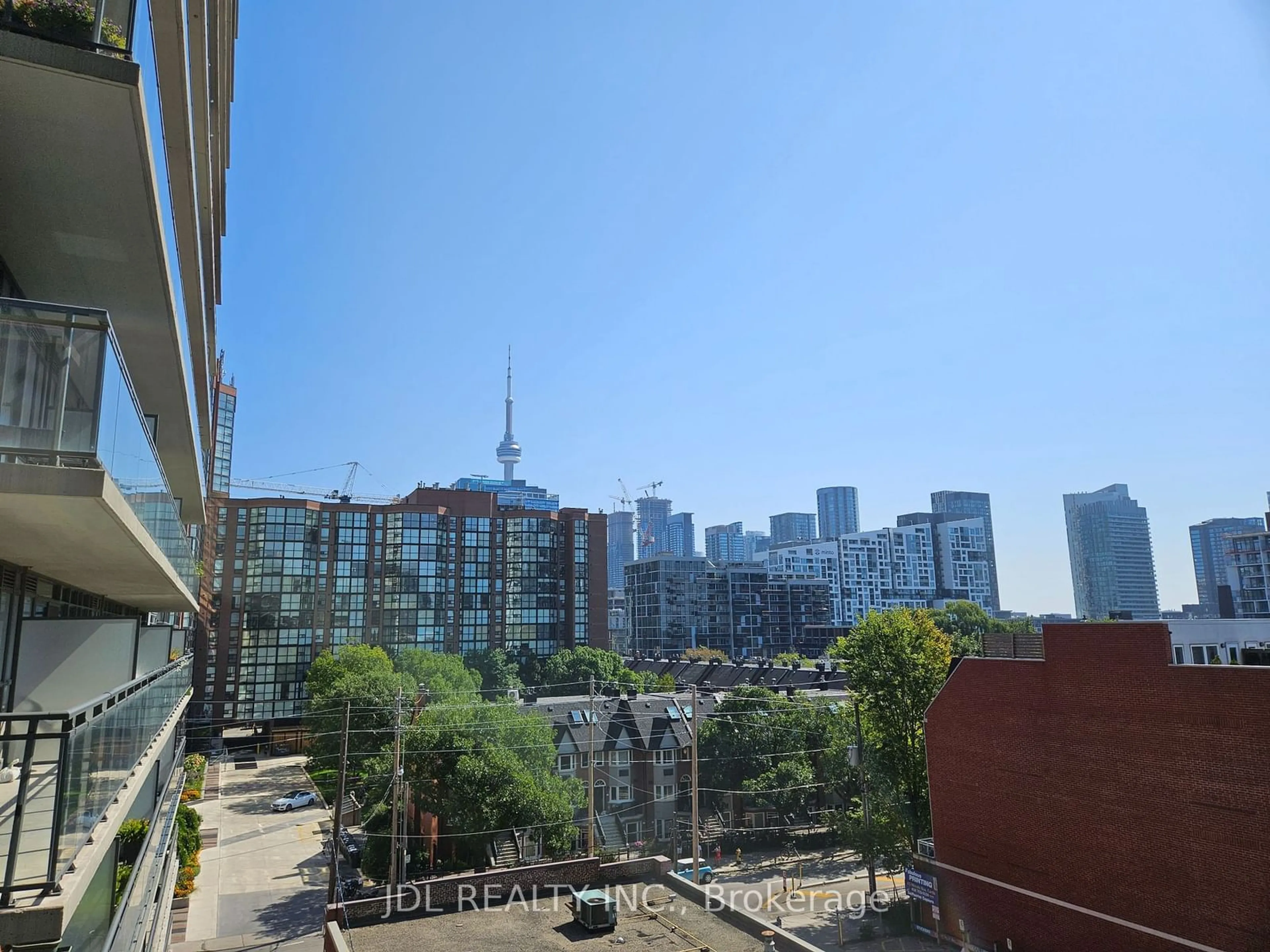 A pic from exterior of the house or condo, the view of city buildings for 775 King St #521, Toronto Ontario M5V 1C9