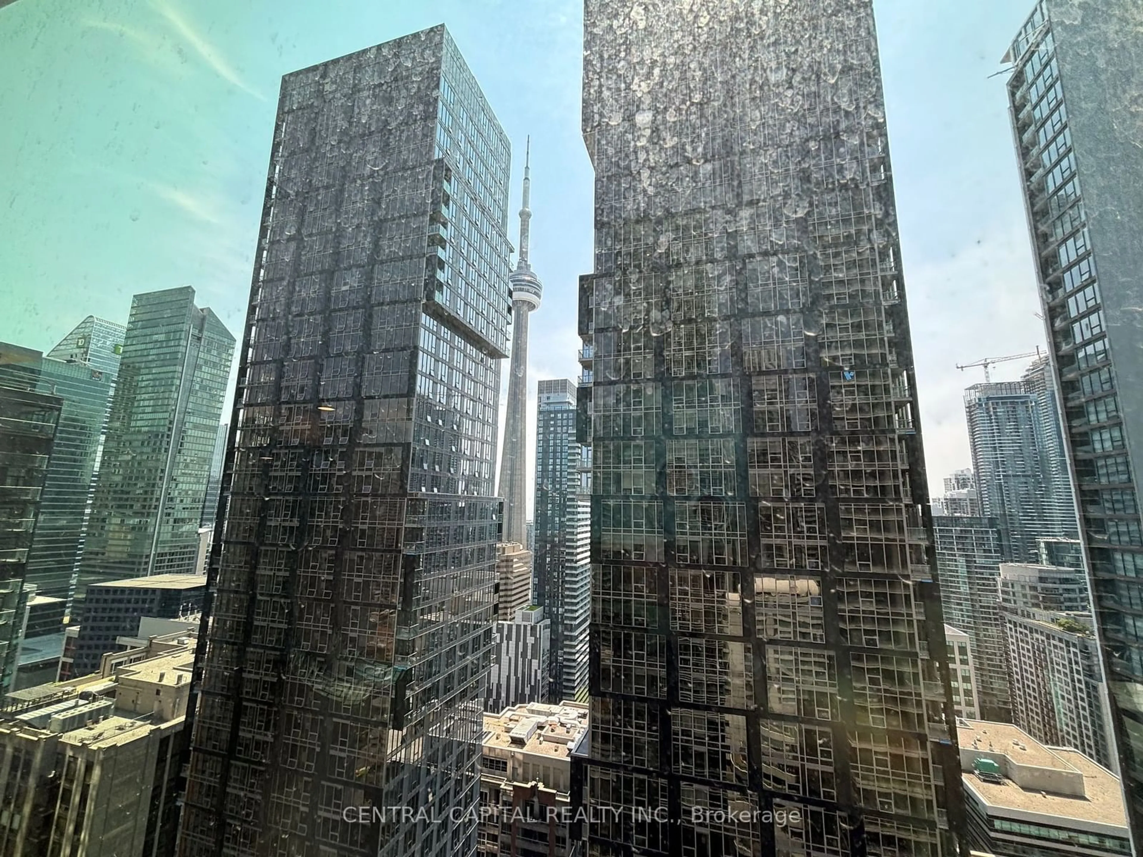 A pic from exterior of the house or condo, the view of city buildings for 327 King St #3003, Toronto Ontario M5V 0W7