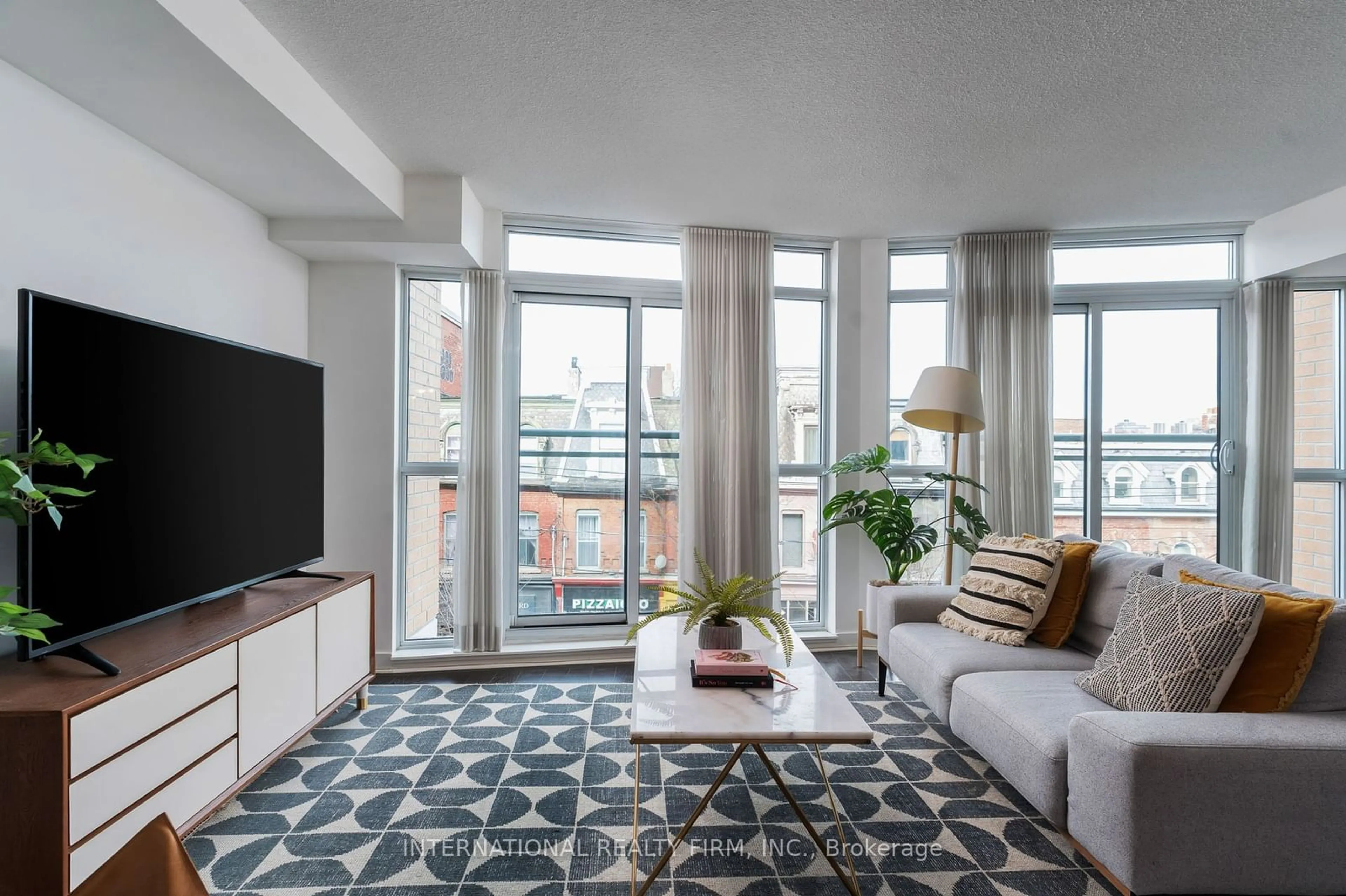 Living room, carpet floors for 1169 Queen St #317, Toronto Ontario M6J 0A4