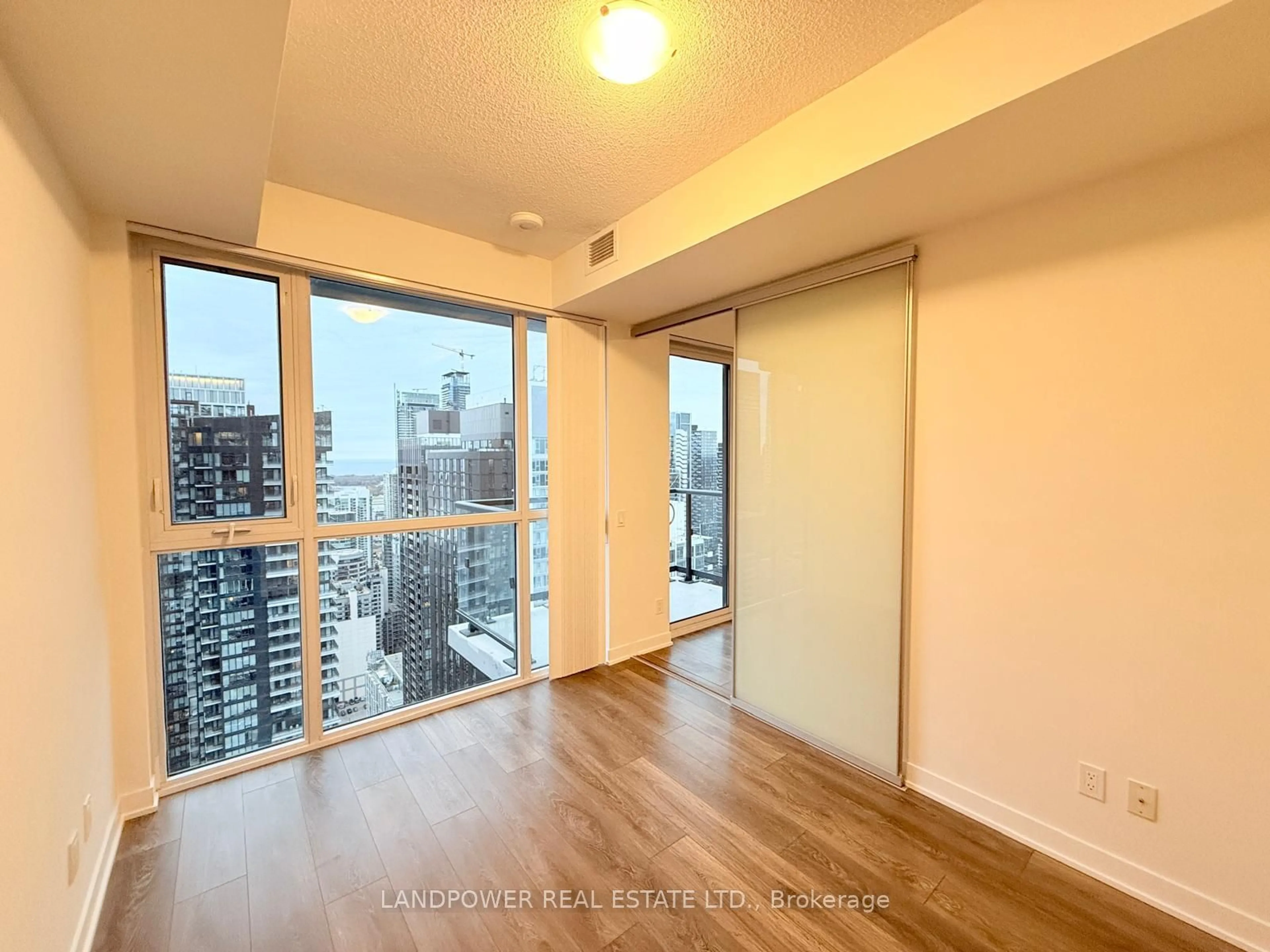 A pic of a room, wood floors for 87 Peter St #4401, Toronto Ontario M5V 0P1