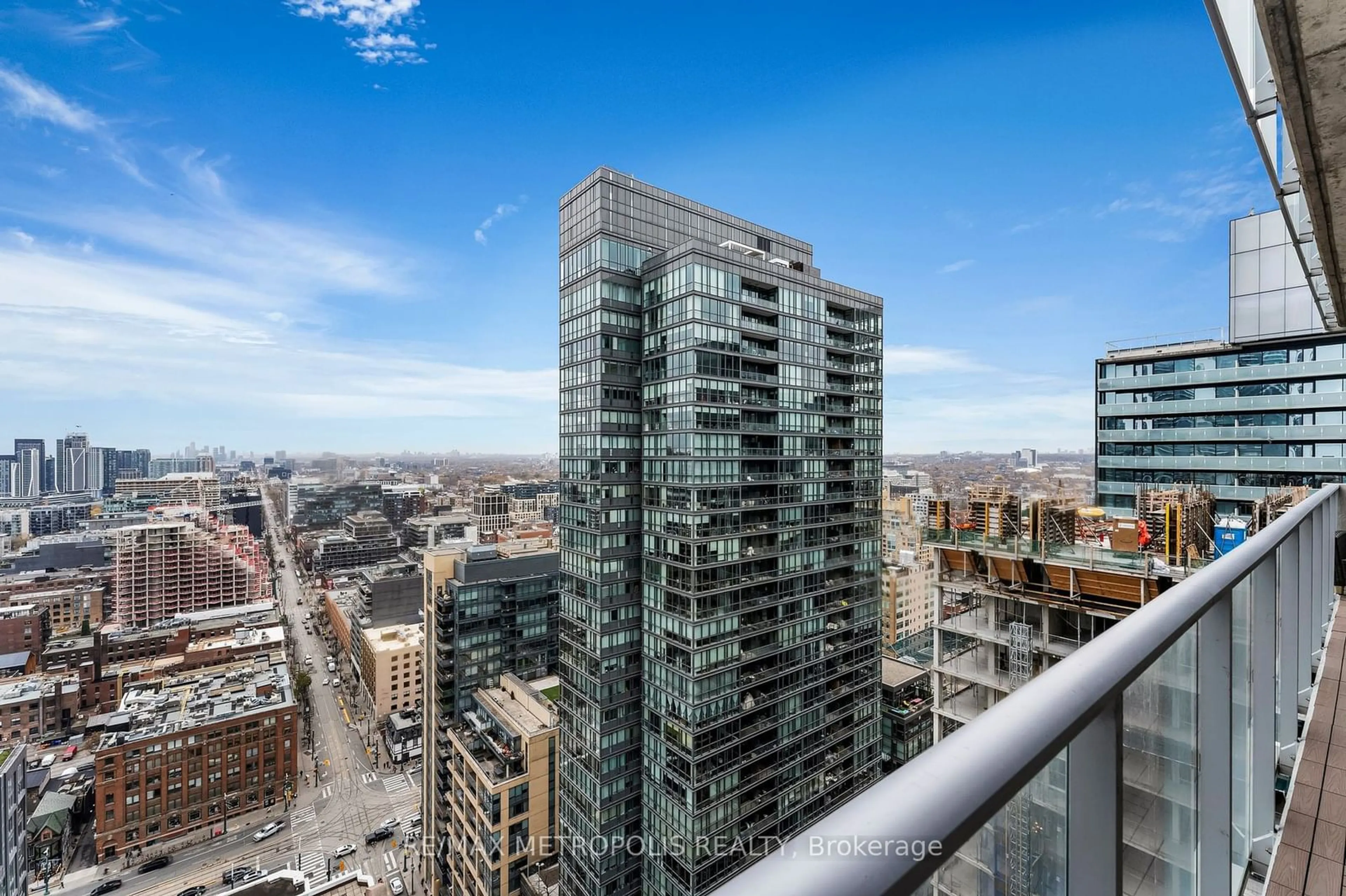 A pic from exterior of the house or condo, the view of city buildings for 375 King St #3009, Toronto Ontario M5V 1K5