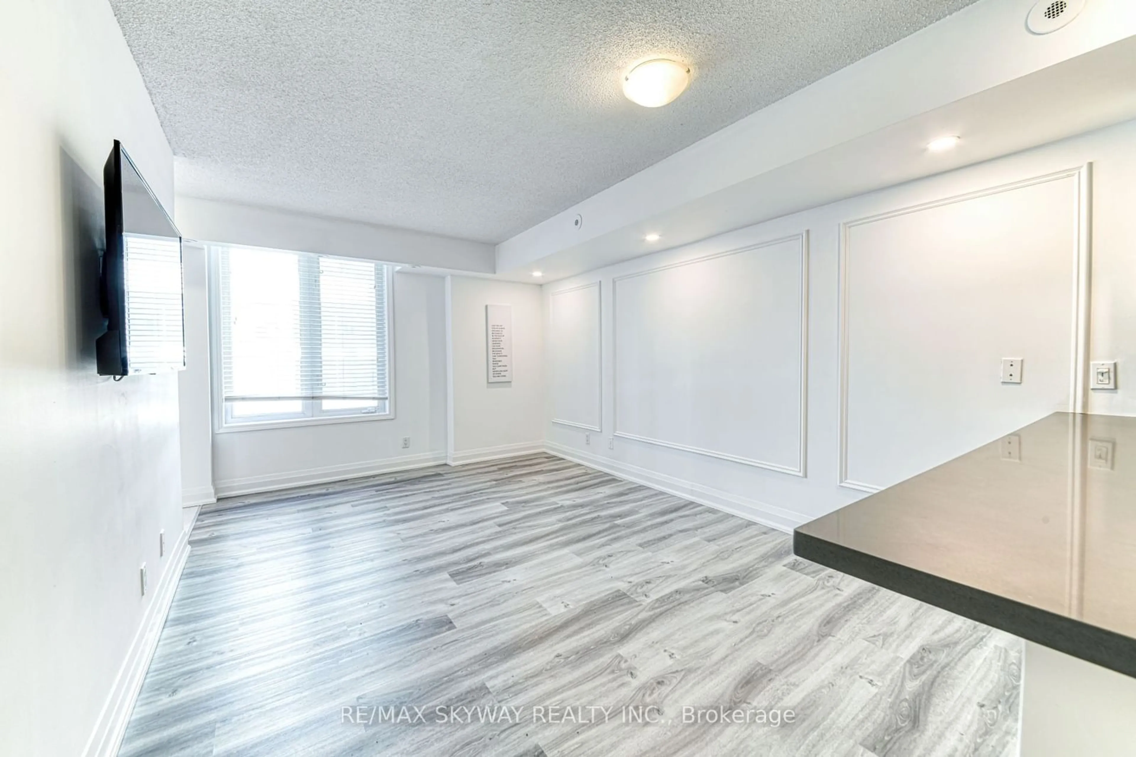 A pic of a room, wood floors for 98 Strachan Ave #614, Toronto Ontario M6J 3M6