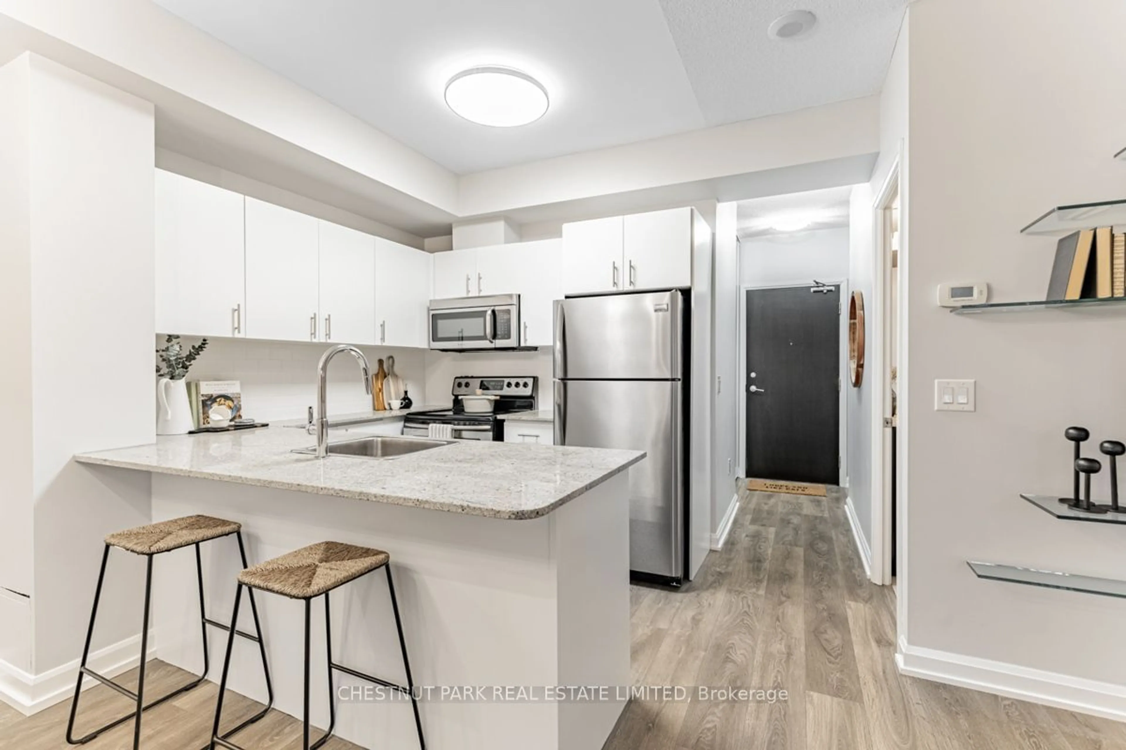 Open concept kitchen for 25 Cole St #328, Toronto Ontario M5A 4M3