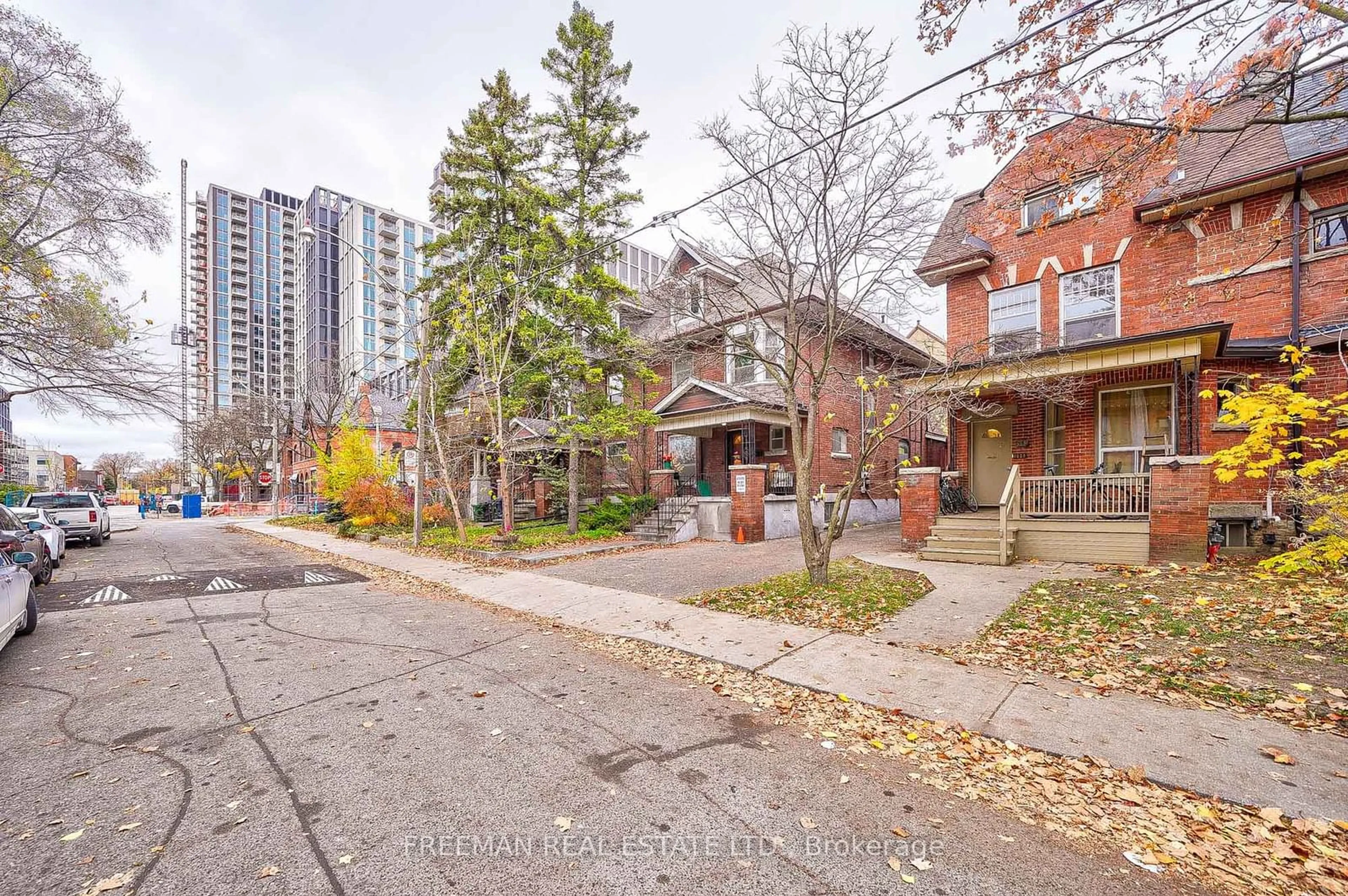 A pic from exterior of the house or condo, the street view for 557 Markham St, Toronto Ontario M6G 2L6