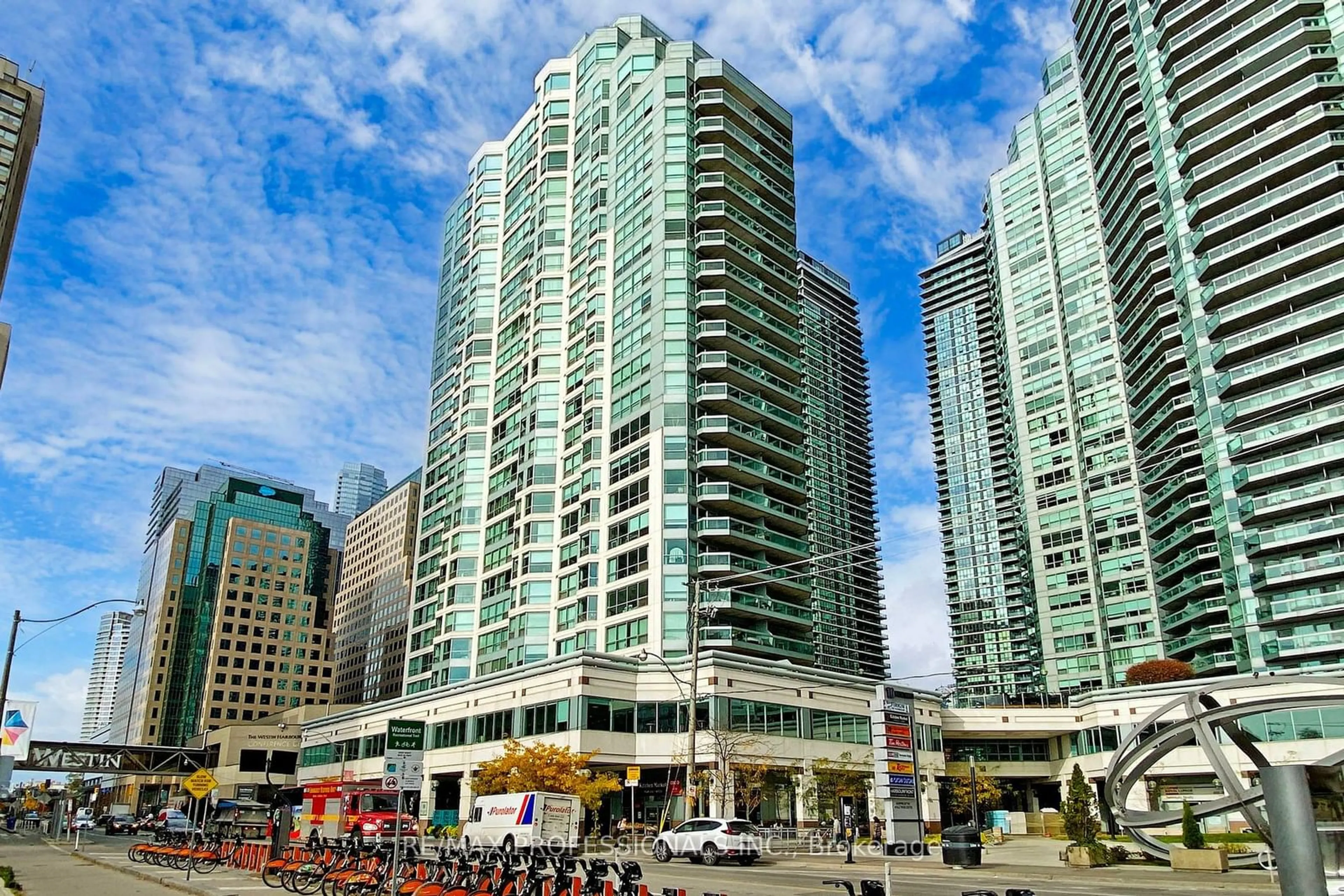 A pic from exterior of the house or condo, the view of city buildings for 10 Queens Quay #1808, Toronto Ontario M5J 2R9