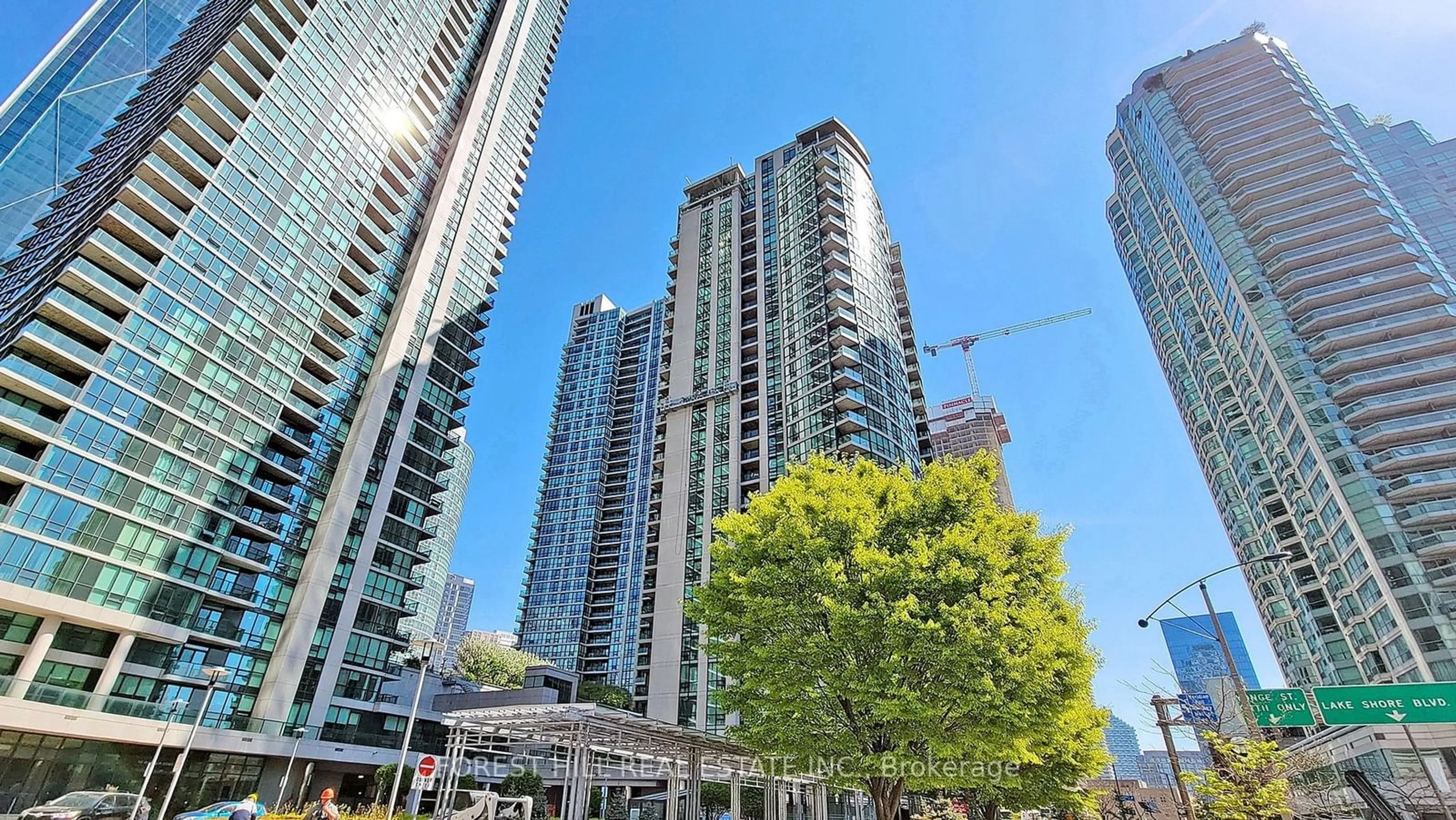 A pic from exterior of the house or condo, the view of city buildings for 16 Yonge St #2207, Toronto Ontario M5E 2A1