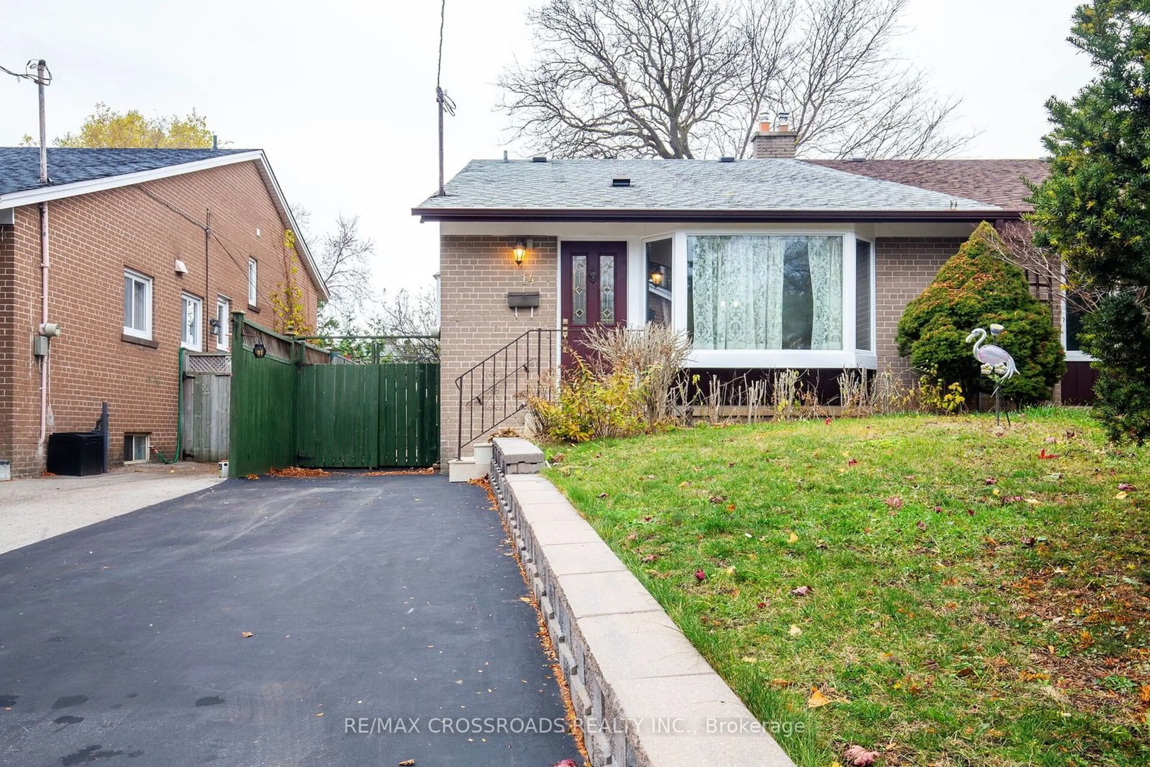 Frontside or backside of a home, the fenced backyard for 14 Baltray Cres, Toronto Ontario M3A 2H4