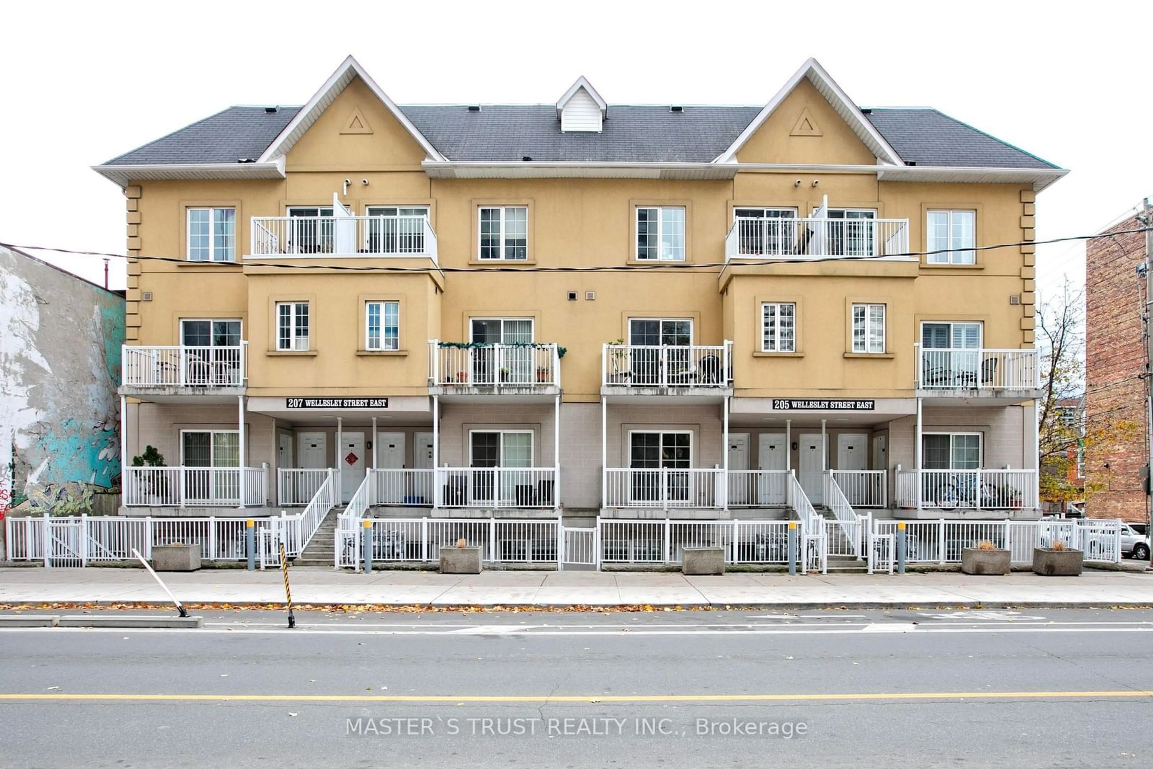 A pic from exterior of the house or condo, the front or back of building for 205 Wellesley St #102, Toronto Ontario M4X 1G1