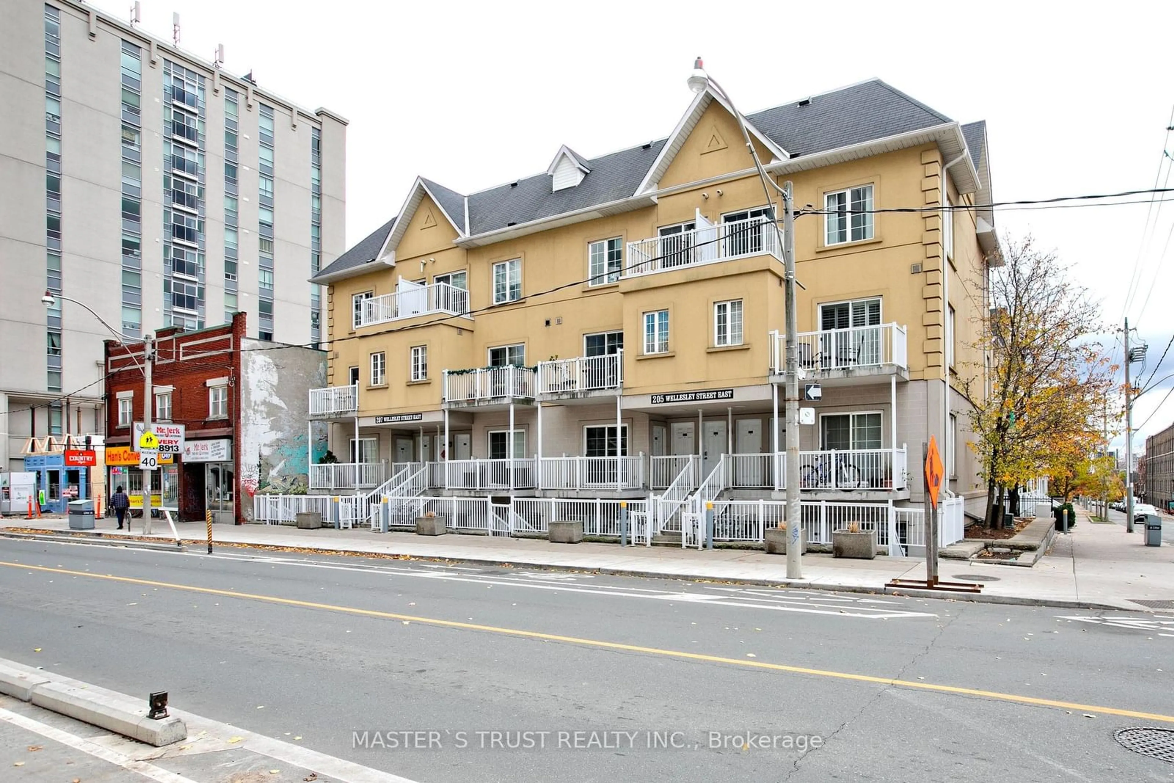 A pic from exterior of the house or condo, the front or back of building for 205 Wellesley St #102, Toronto Ontario M4X 1G1