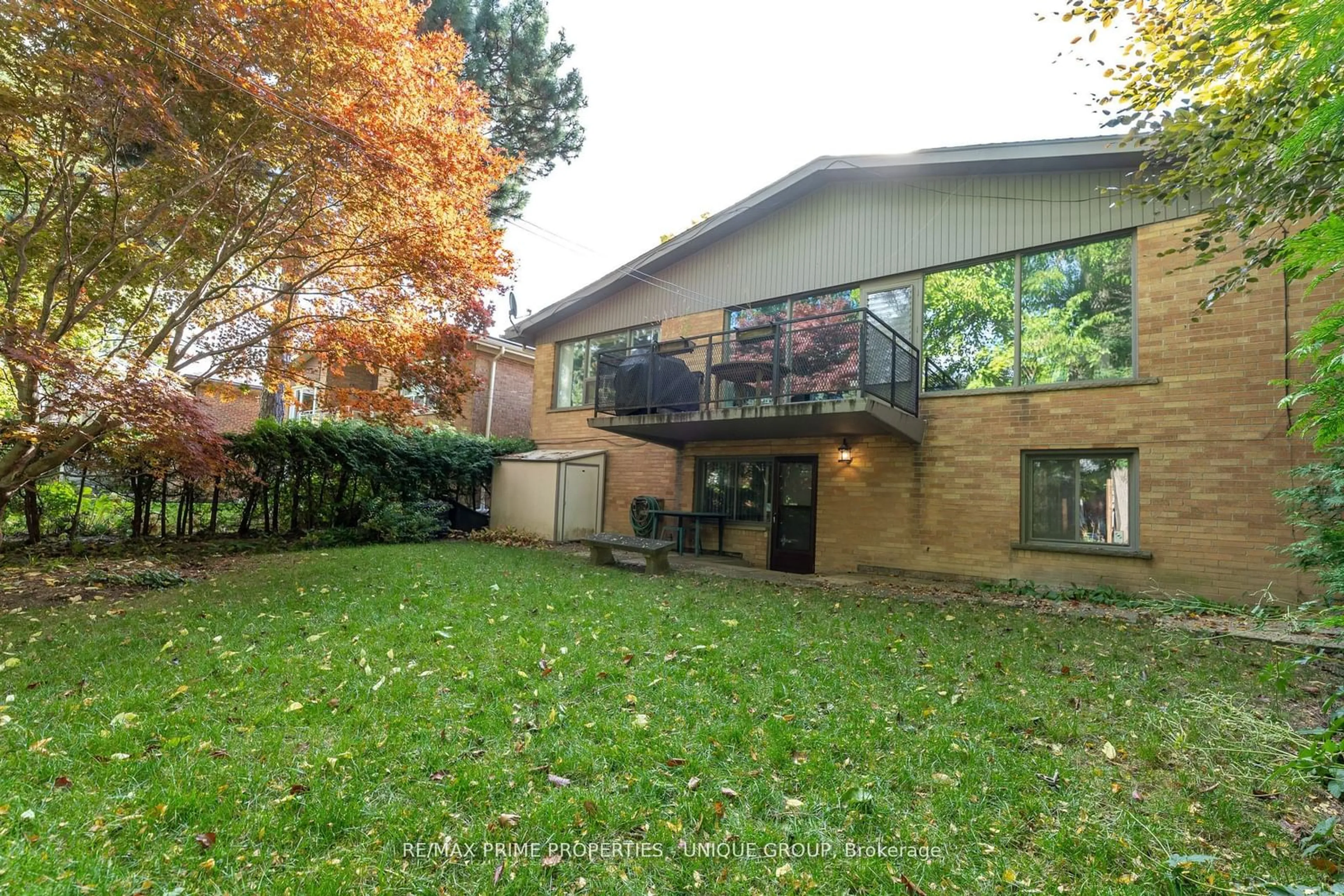 A pic from exterior of the house or condo, the fenced backyard for 86 Prue Ave, Toronto Ontario M6B 1R5