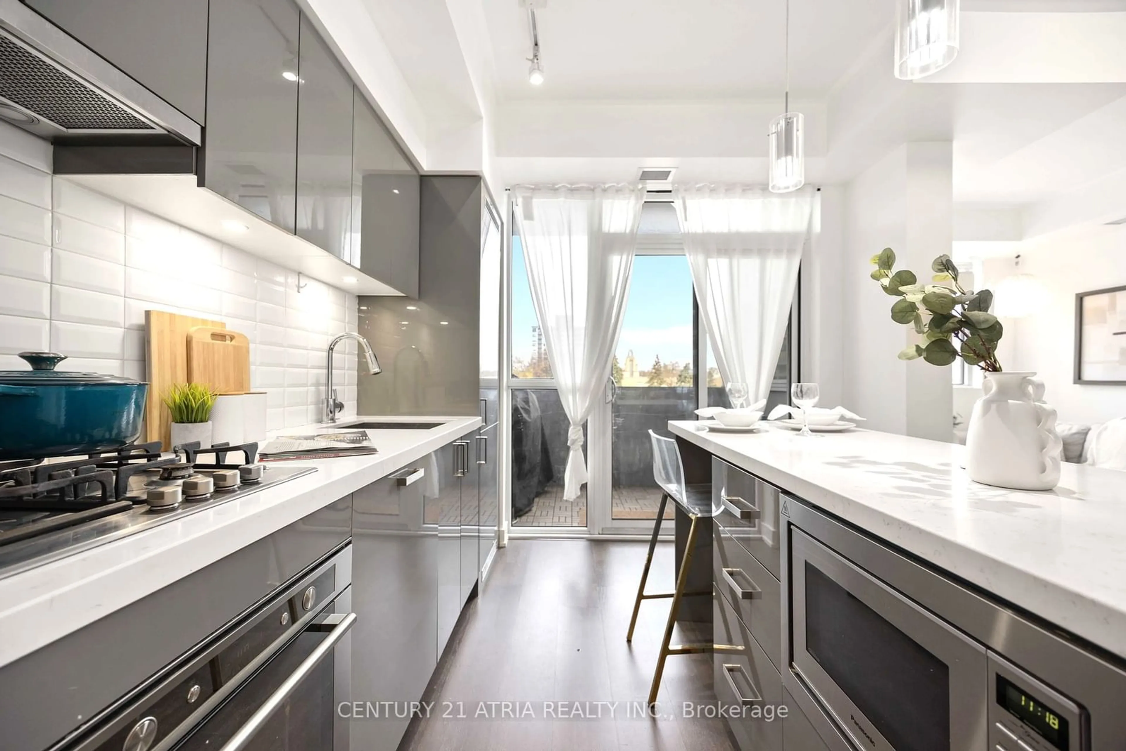 Contemporary kitchen, wood floors for 501 St Clair Ave #303, Toronto Ontario M5P 0A2