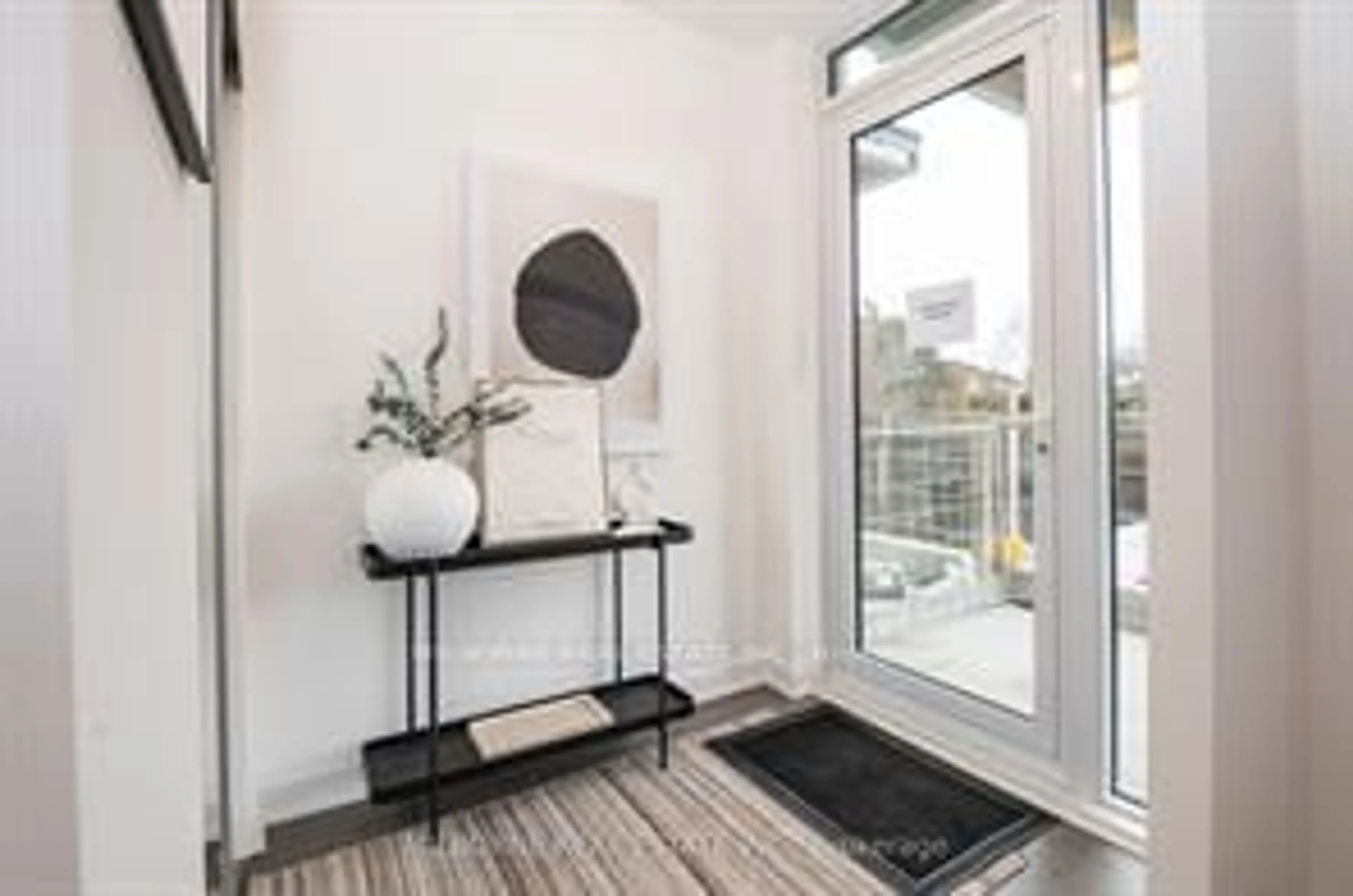 Indoor entryway, wood floors for 20 O'Neill Rd #TH101, Toronto Ontario M3C 0R2