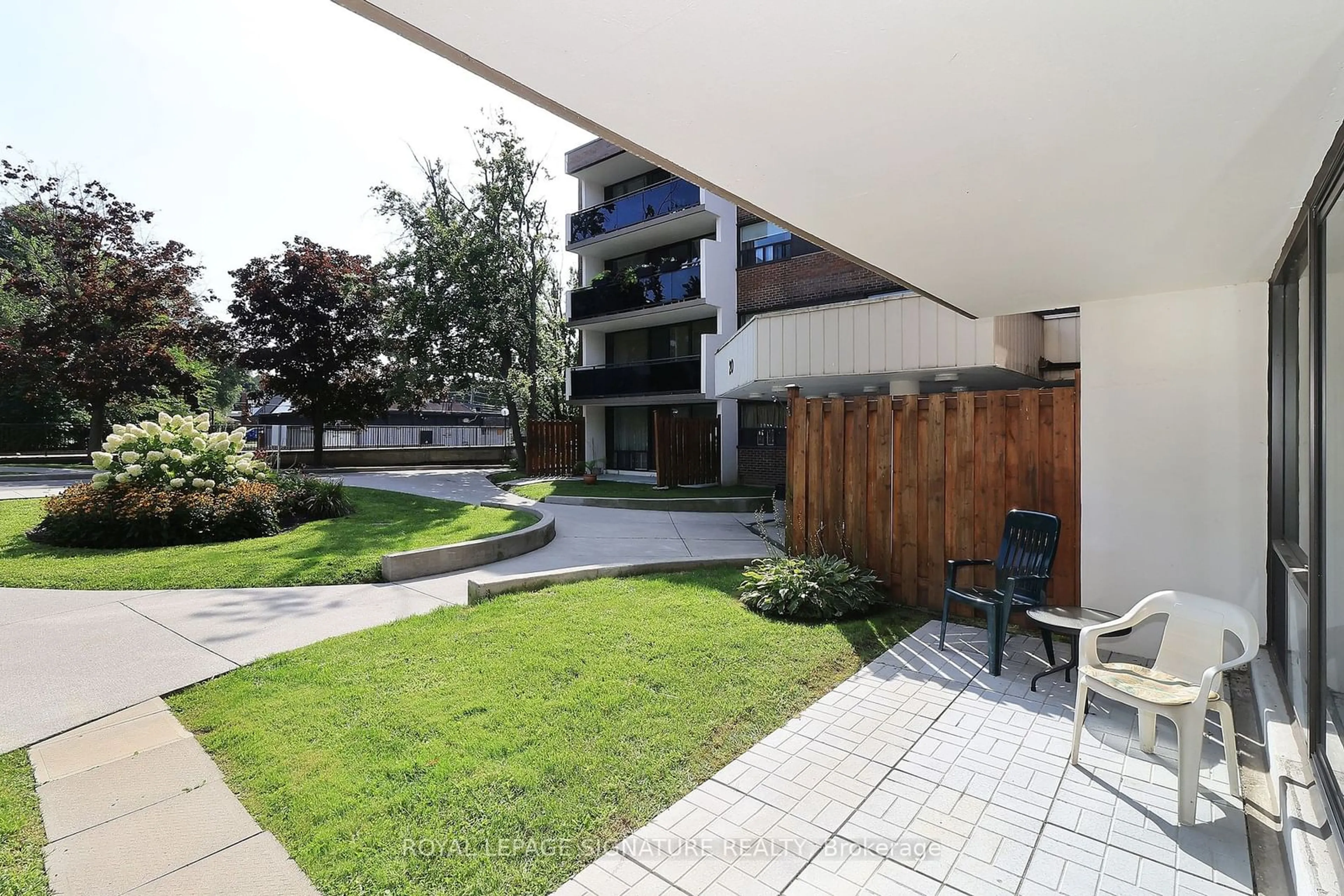 Patio, the front or back of building for 20 Sunrise Ave #114, Toronto Ontario M4A 2R2