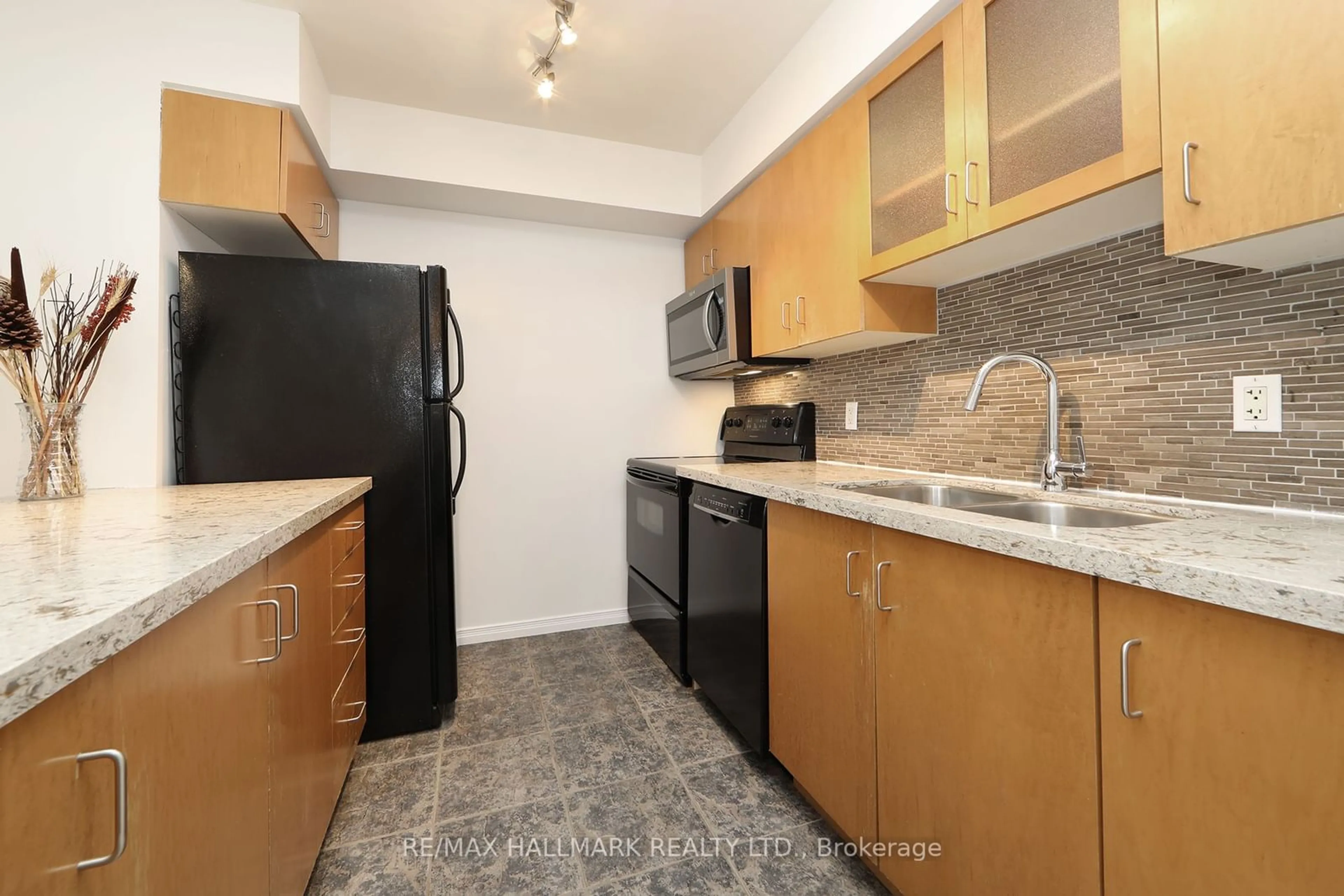 Standard kitchen, carpet floors for 21 Pirandello St #1237, Toronto Ontario M6K 3P4