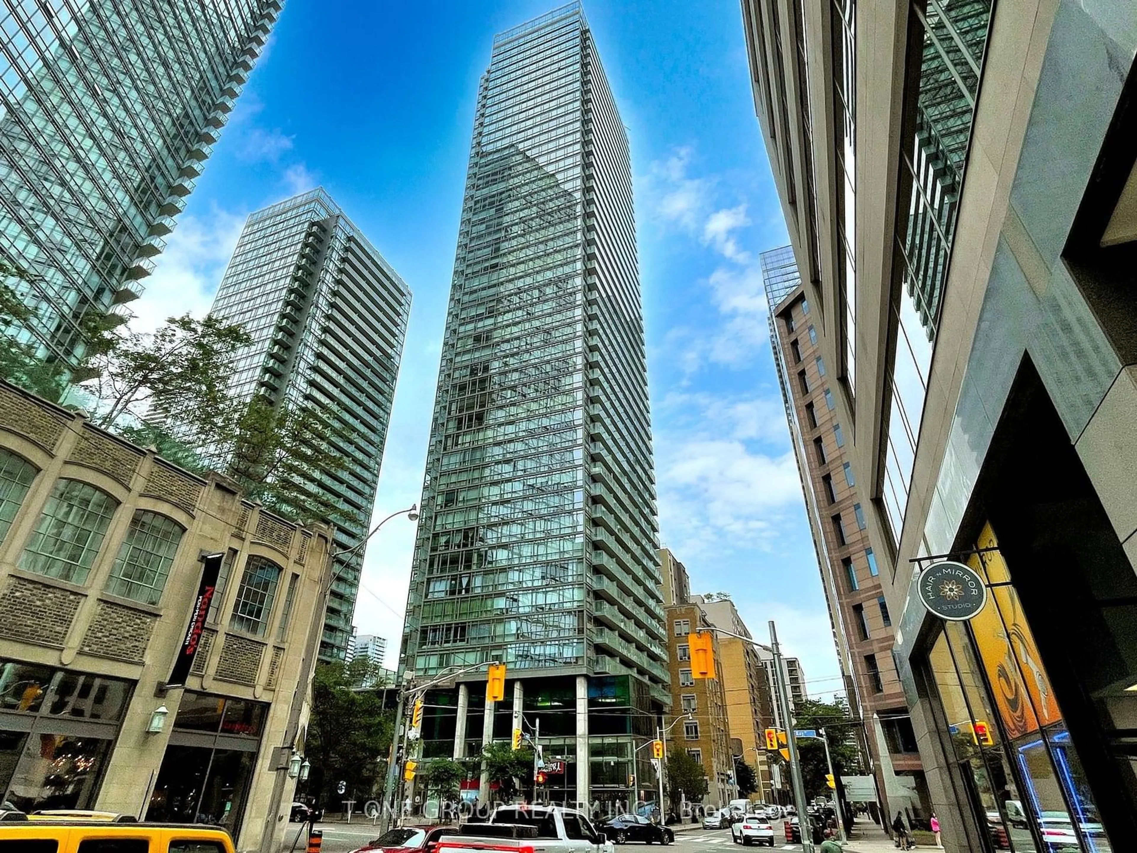 A pic from exterior of the house or condo, the view of city buildings for 38 Grenville St #2503, Toronto Ontario M4Y 1A5