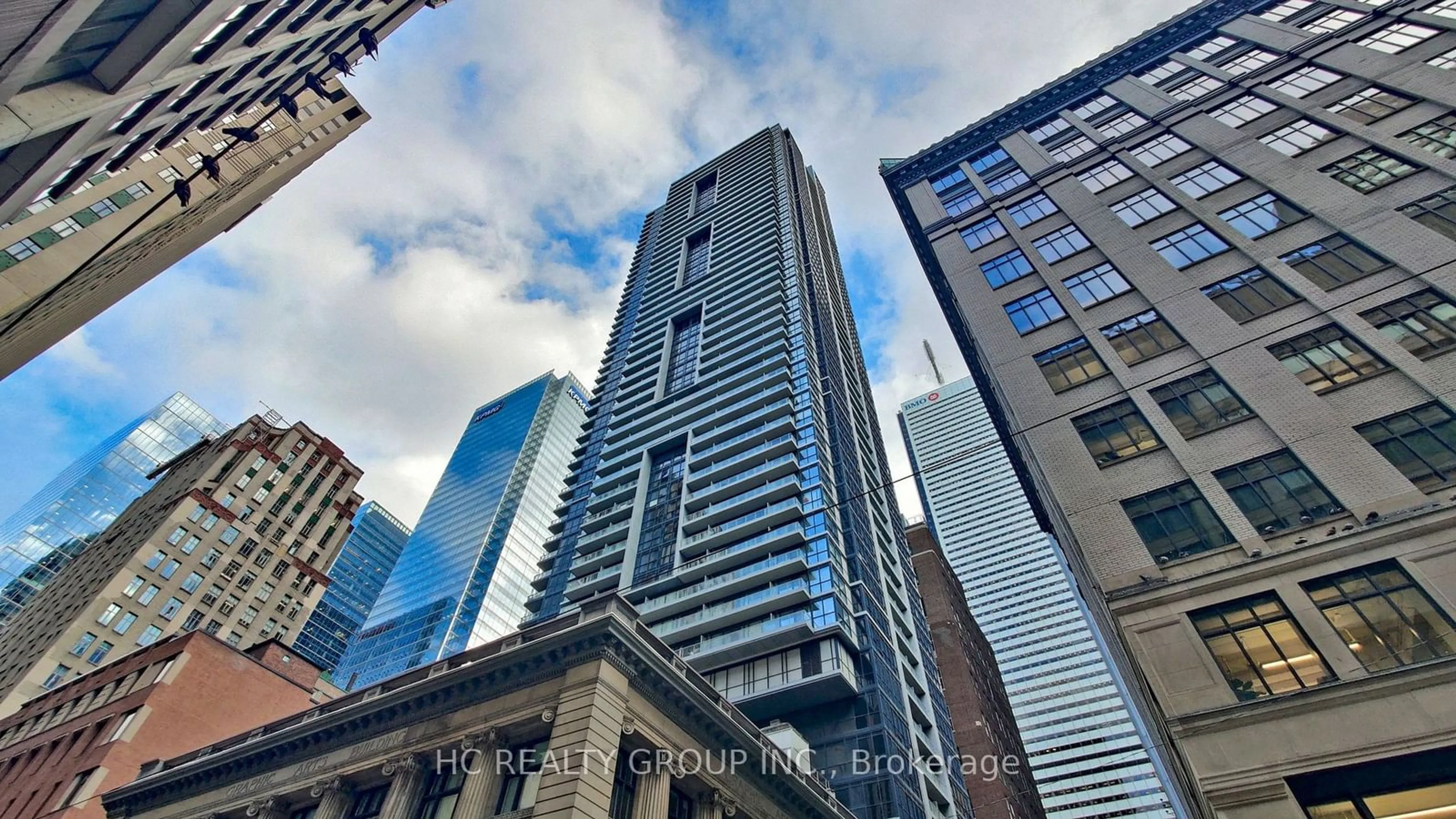 A pic from exterior of the house or condo, the view of city buildings for 70 Temperance St #5206, Toronto Ontario M5H 0B1