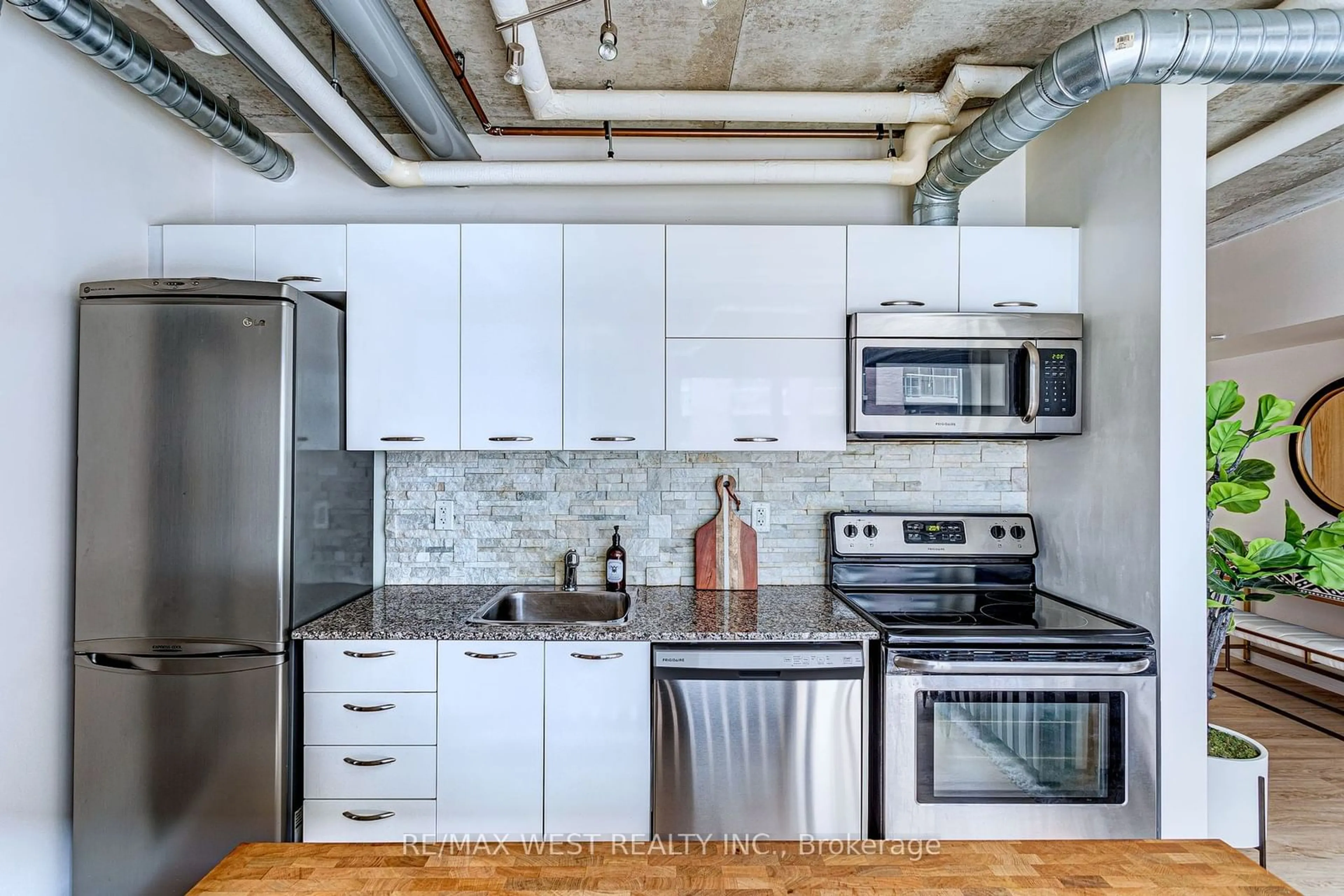 Standard kitchen, cement floor for 170 Sudbury St #407, Toronto Ontario M6J 0A1