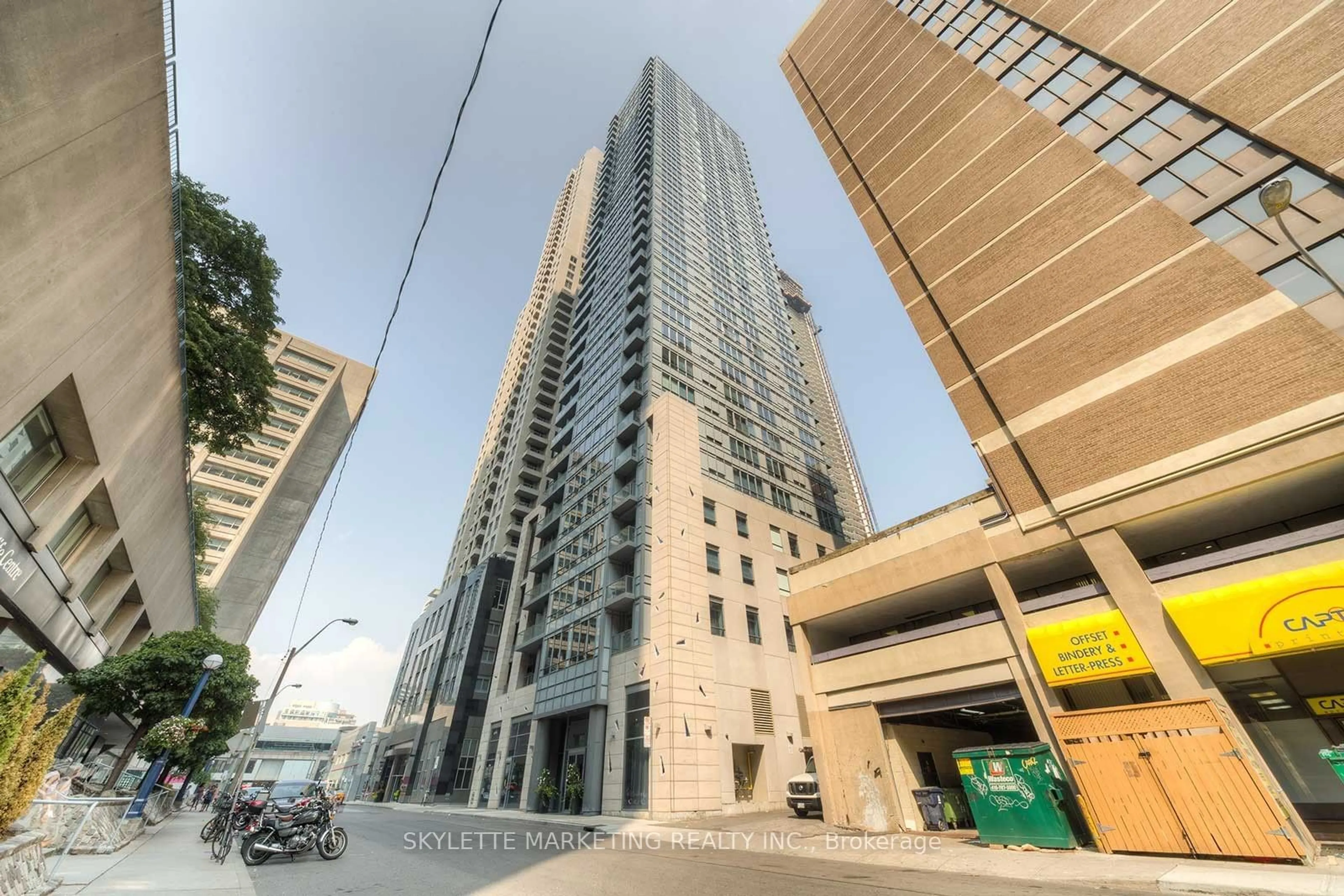 A pic from exterior of the house or condo, the street view for 21 Balmuto St #604, Toronto Ontario M4Y 1W4