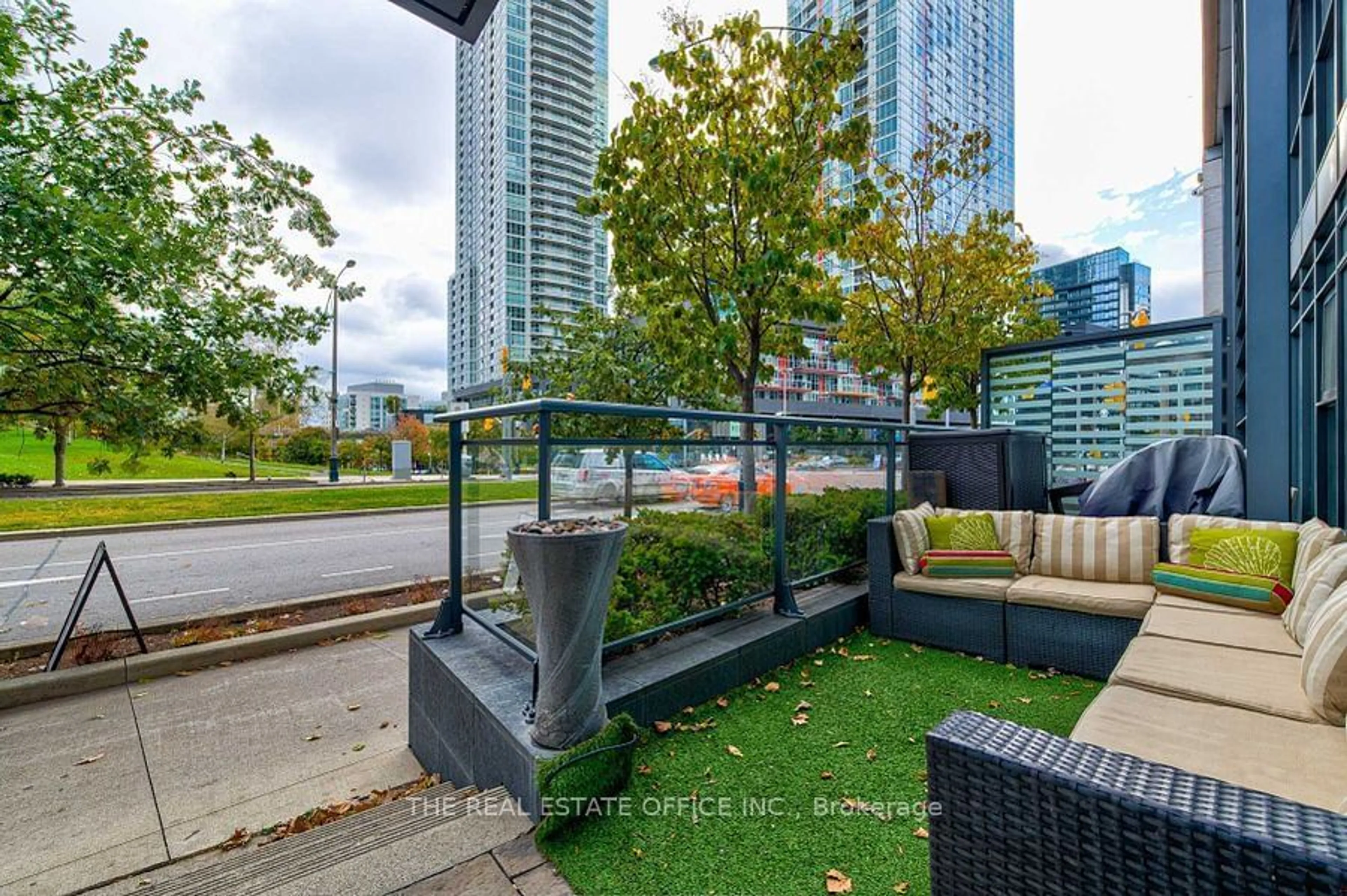 Patio, city buildings view from balcony for 112 Fort York Blvd #G09, Toronto Ontario M5V 4A7