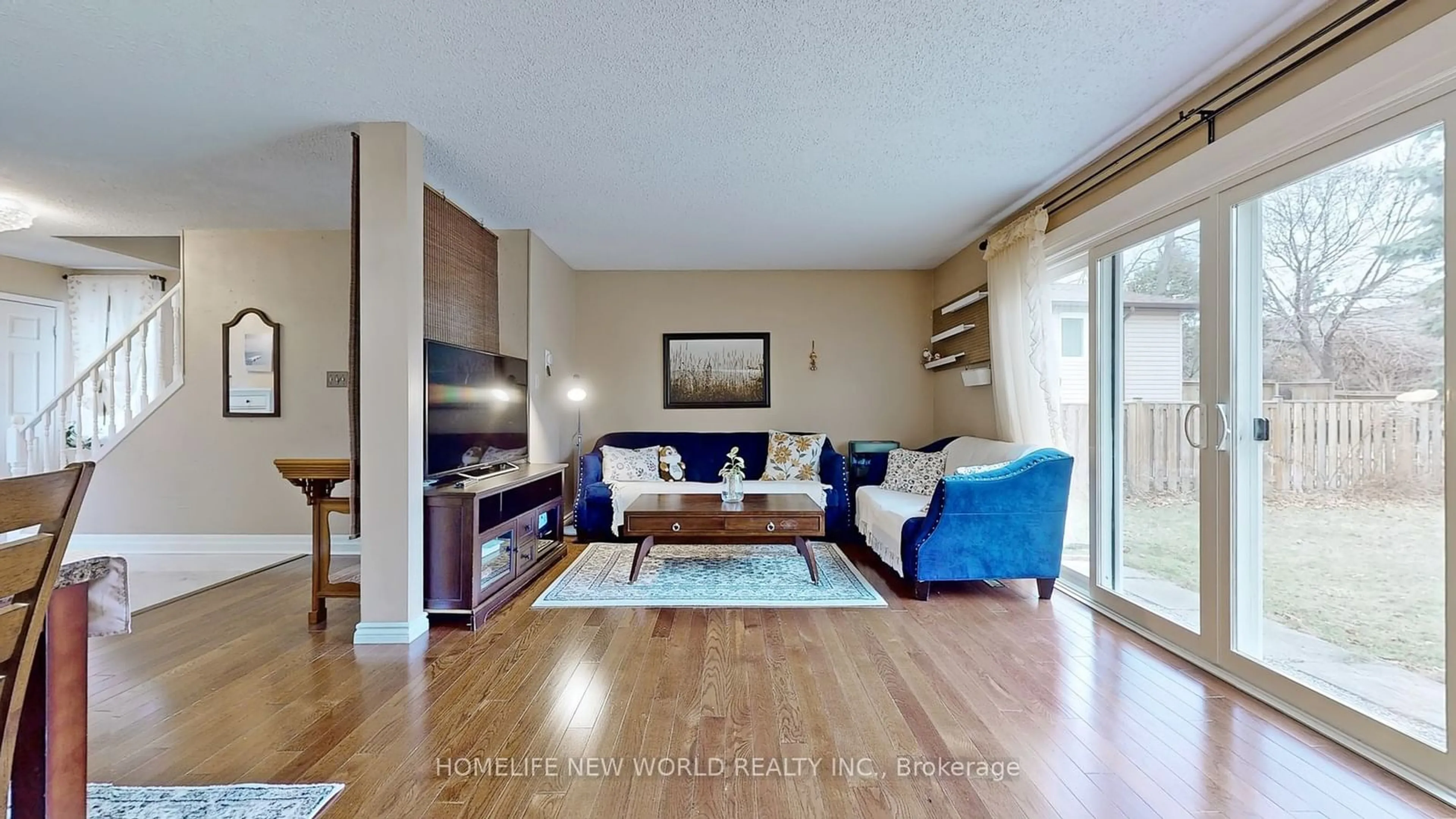 Living room with furniture, wood/laminate floor for 227 Hollyberry Tr, Toronto Ontario M2H 2P3