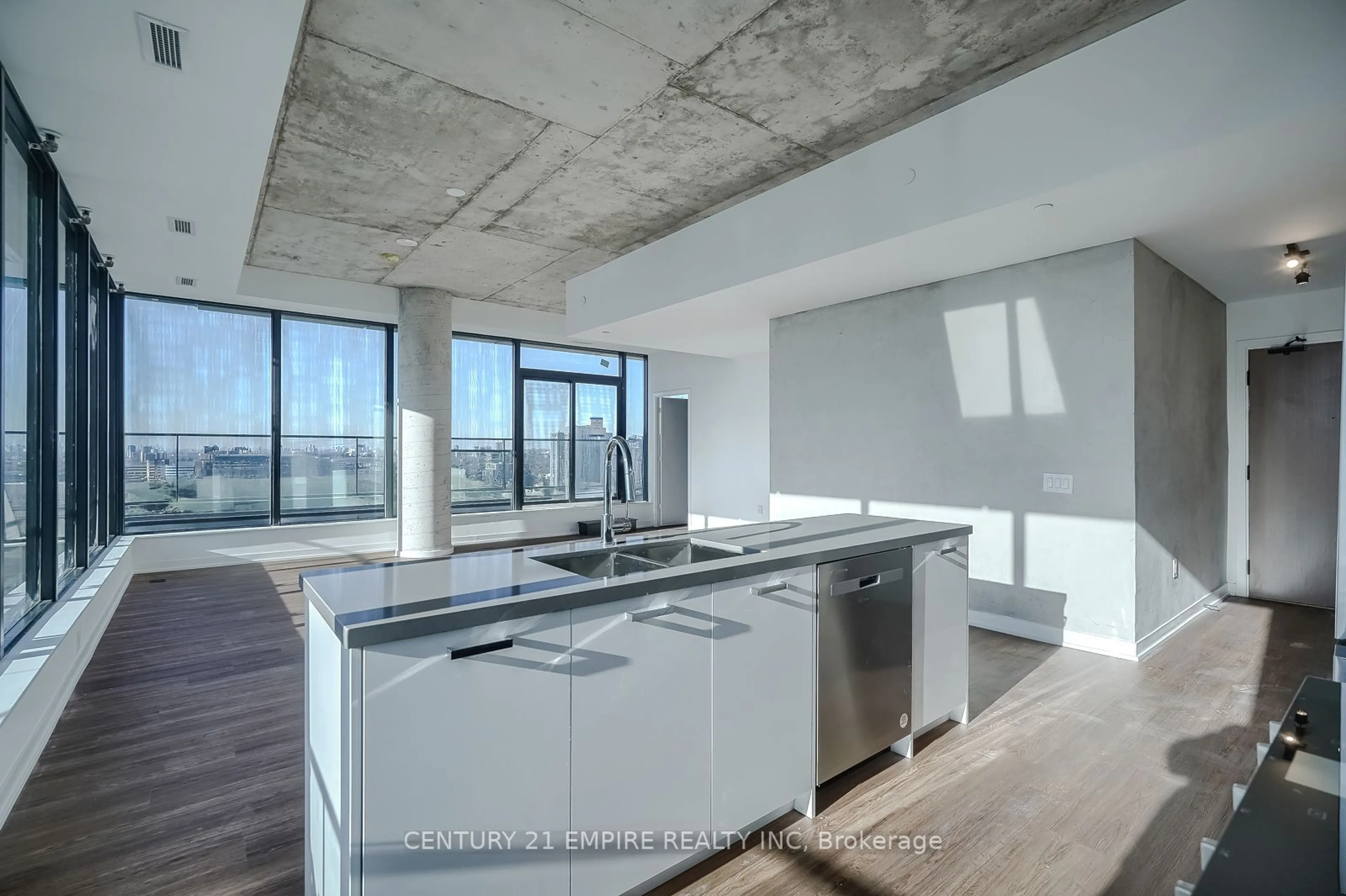 Open concept kitchen, cement floor for 195 McCaul St #2002, Toronto Ontario M5A 0S8