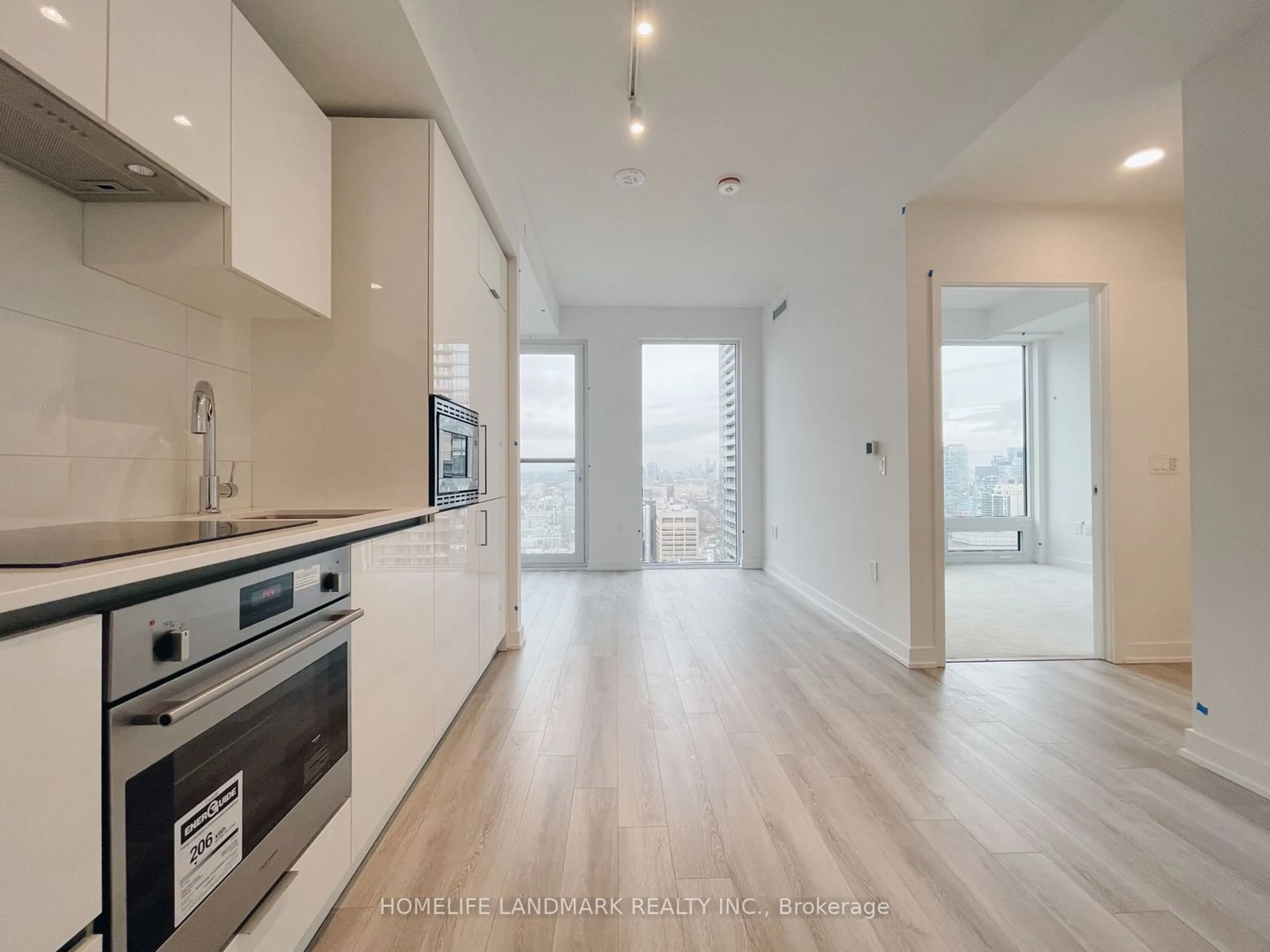 Open concept kitchen, wood/laminate floor for 238 Simcoe St #3702, Toronto Ontario M5T 1T4