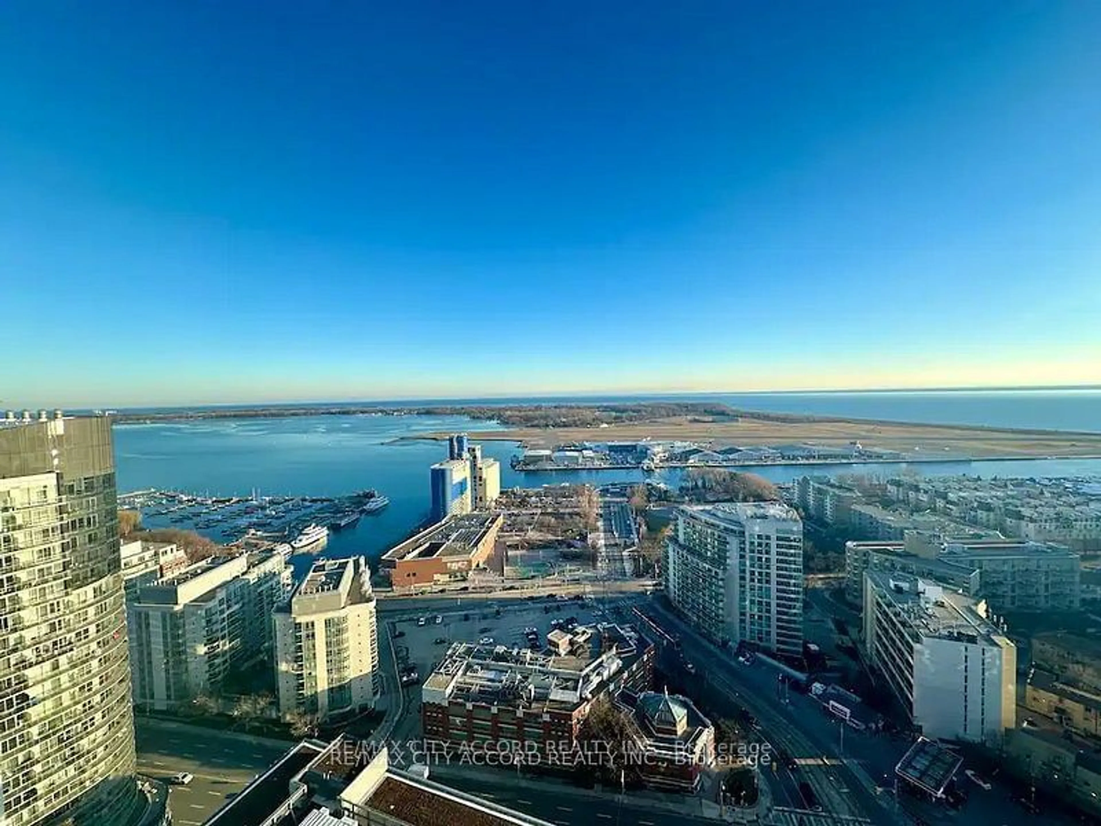 A pic from outside/outdoor area/front of a property/back of a property/a pic from drone, city buildings view from balcony for 19 Bathurst St #3711, Toronto Ontario M6A 2E1