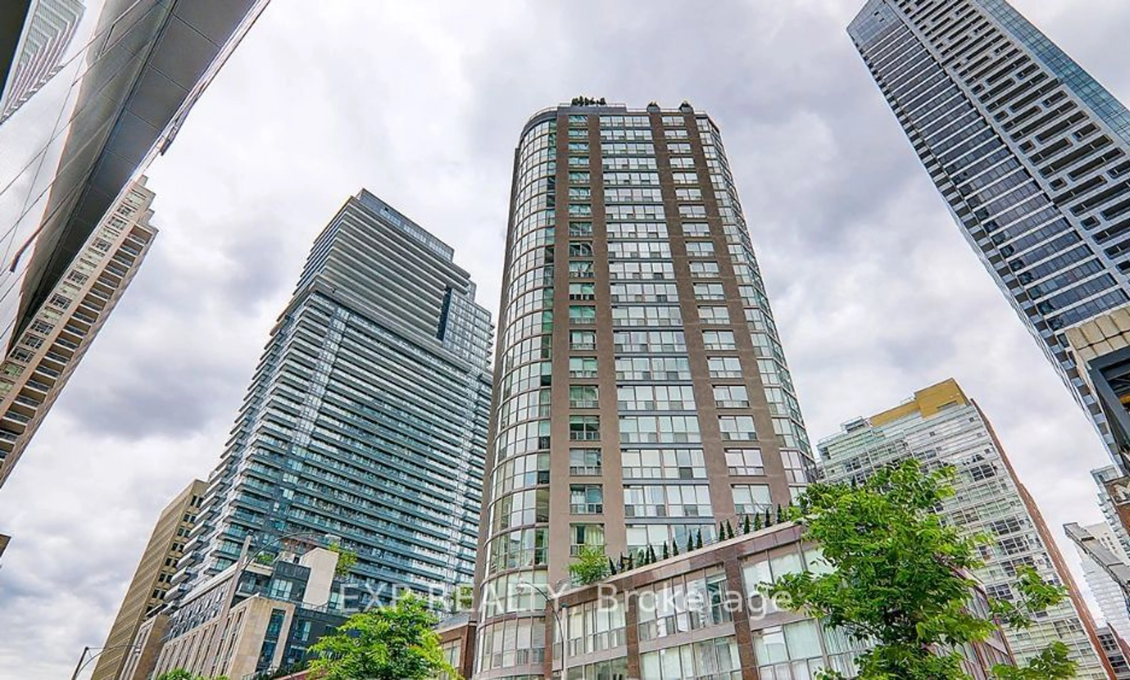 Patio, city buildings view from balcony for 24 Wellesley St #2508, Toronto Ontario M4Y 2X6