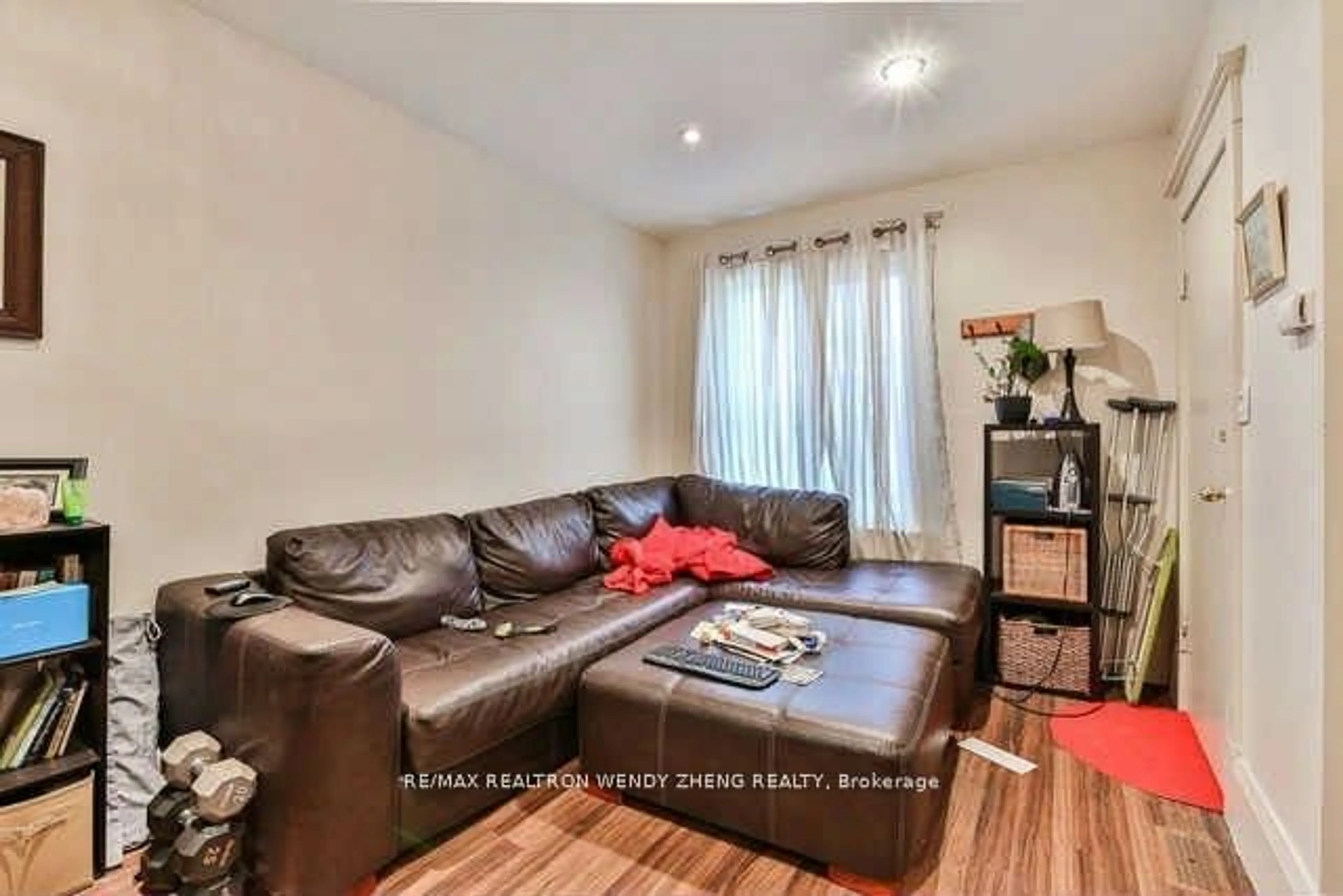 Living room with furniture, wood/laminate floor for 1145 Davenport Rd, Toronto Ontario M6H 2G4