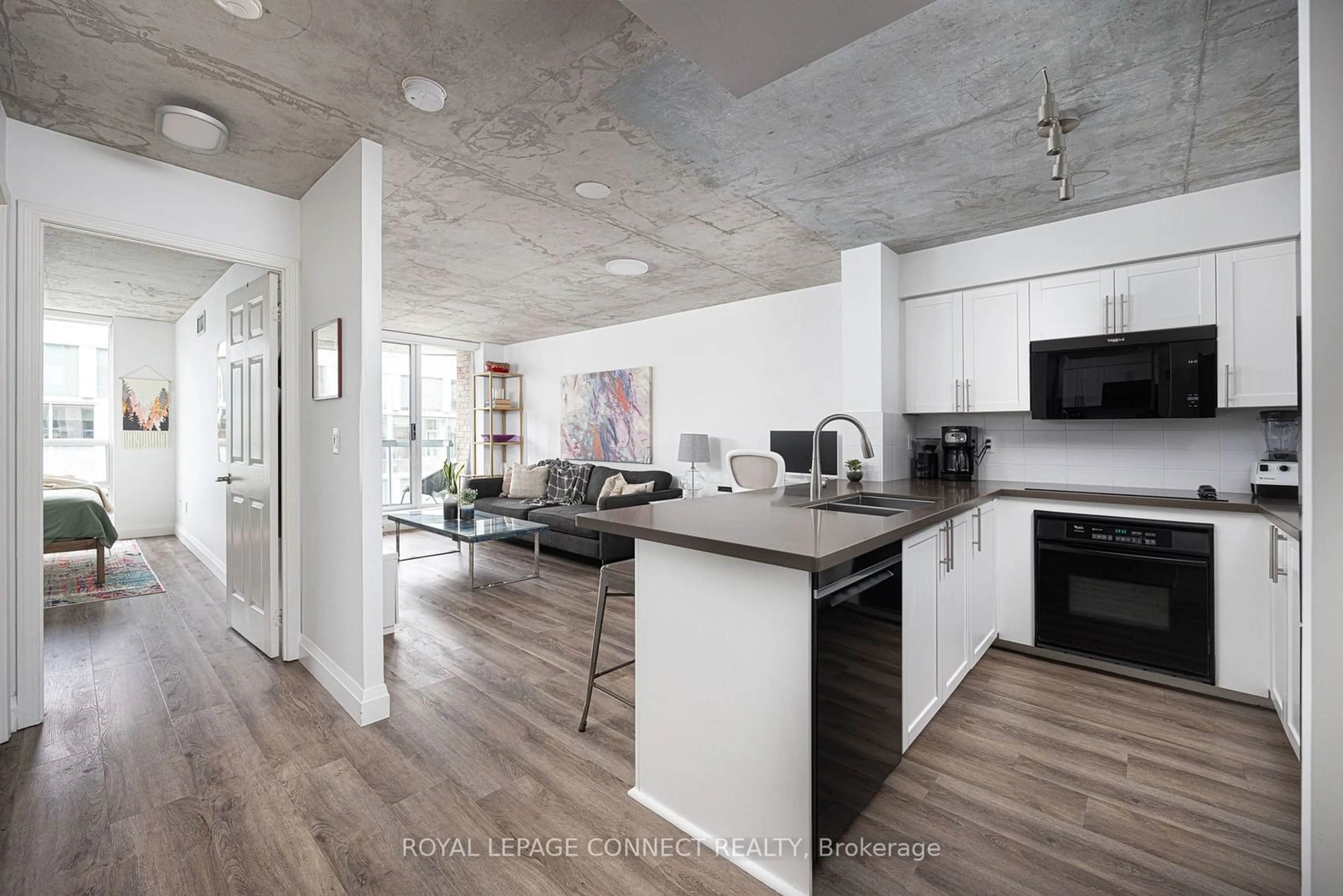 Open concept kitchen, cement floor for 311 Richmond St #705, Toronto Ontario M5A 4S8