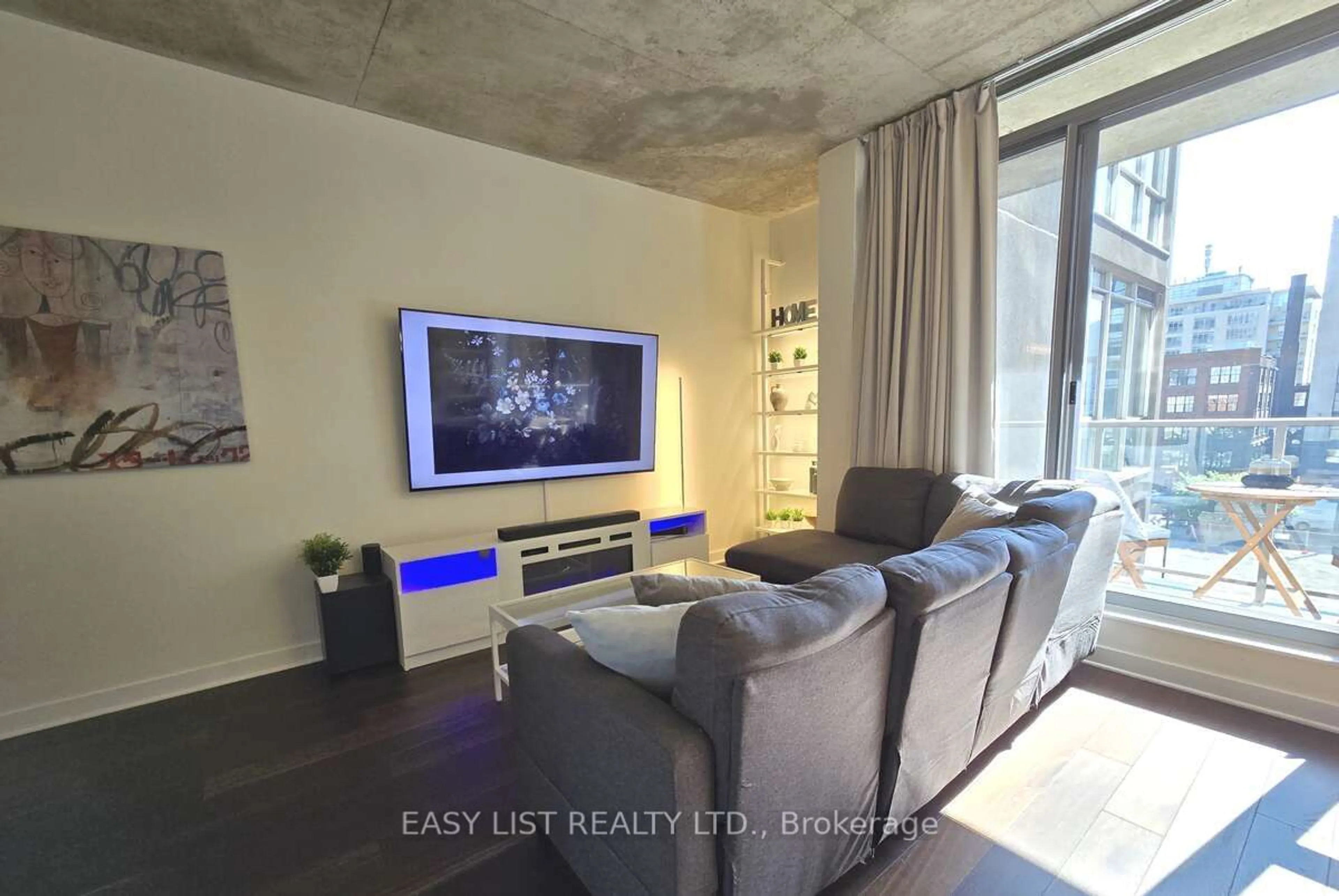 Living room with furniture, cement floor for 36 Charlotte St #501, Toronto Ontario M5V 3P7