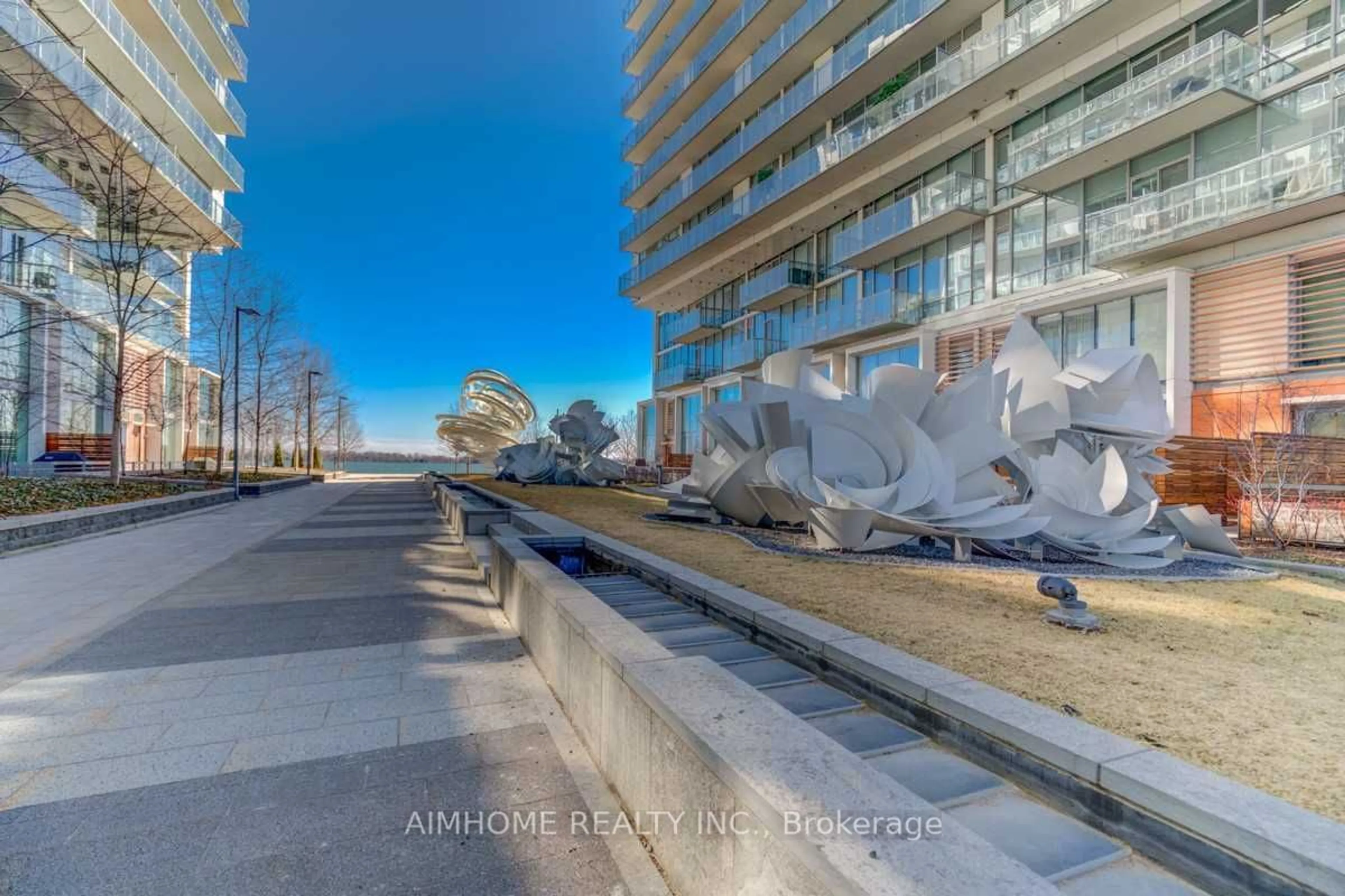 A pic from outside/outdoor area/front of a property/back of a property/a pic from drone, unknown for 39 Queens Quay #Th 111, Toronto Ontario M5E 0A5