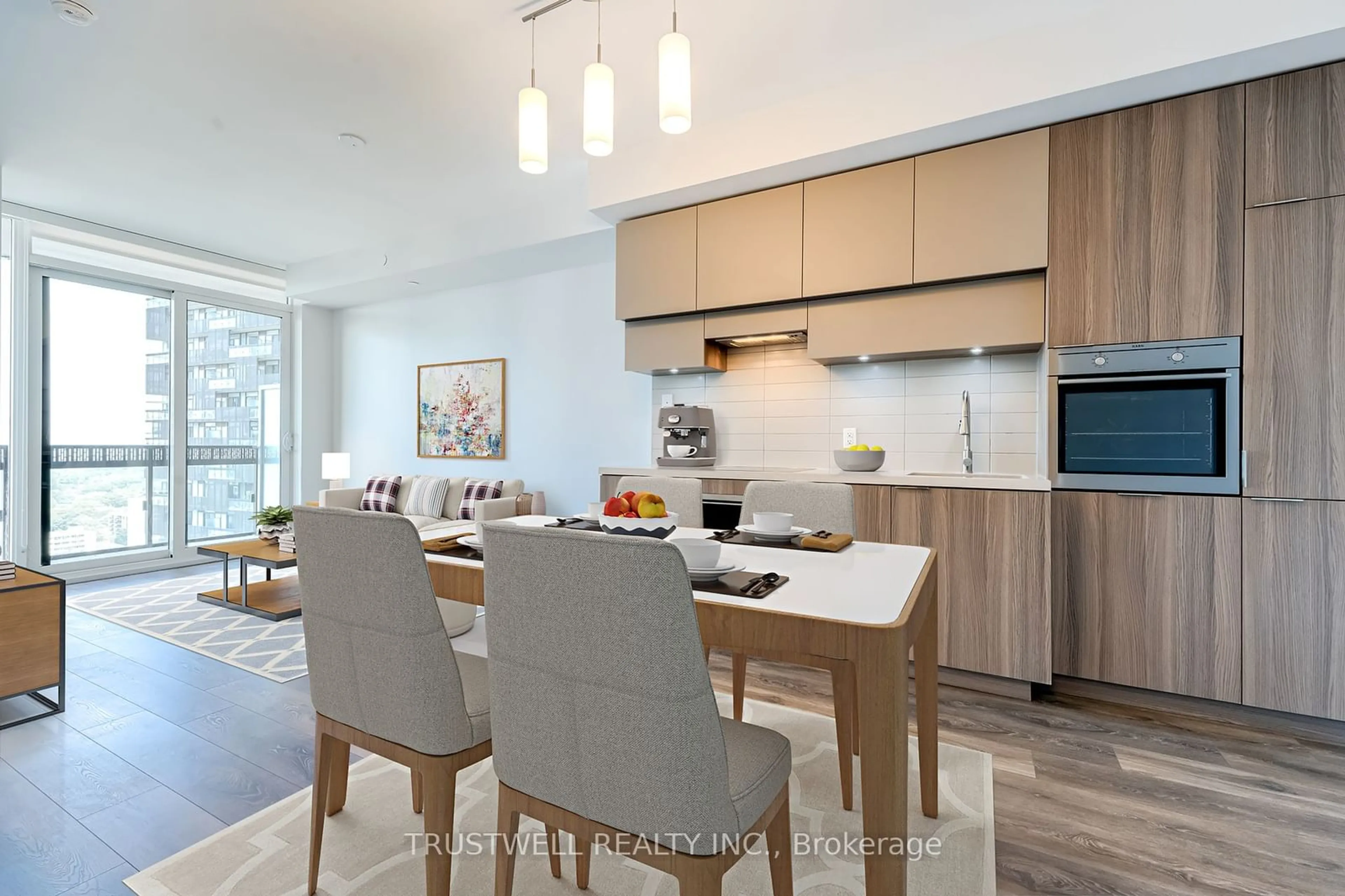 Open concept kitchen, wood/laminate floor for 8 Eglinton Ave #2106, Toronto Ontario M4P 0C1