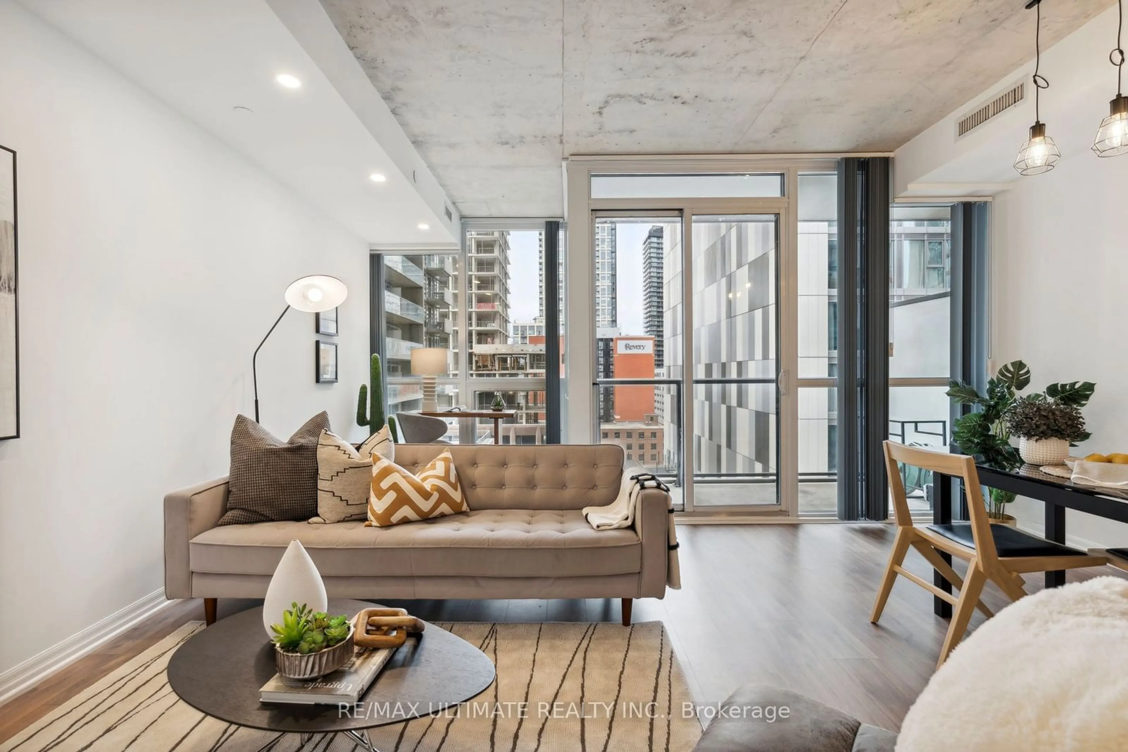 Living room with furniture, cement floor for 88 Blue Jays Way #1115, Toronto Ontario M5V 0L7