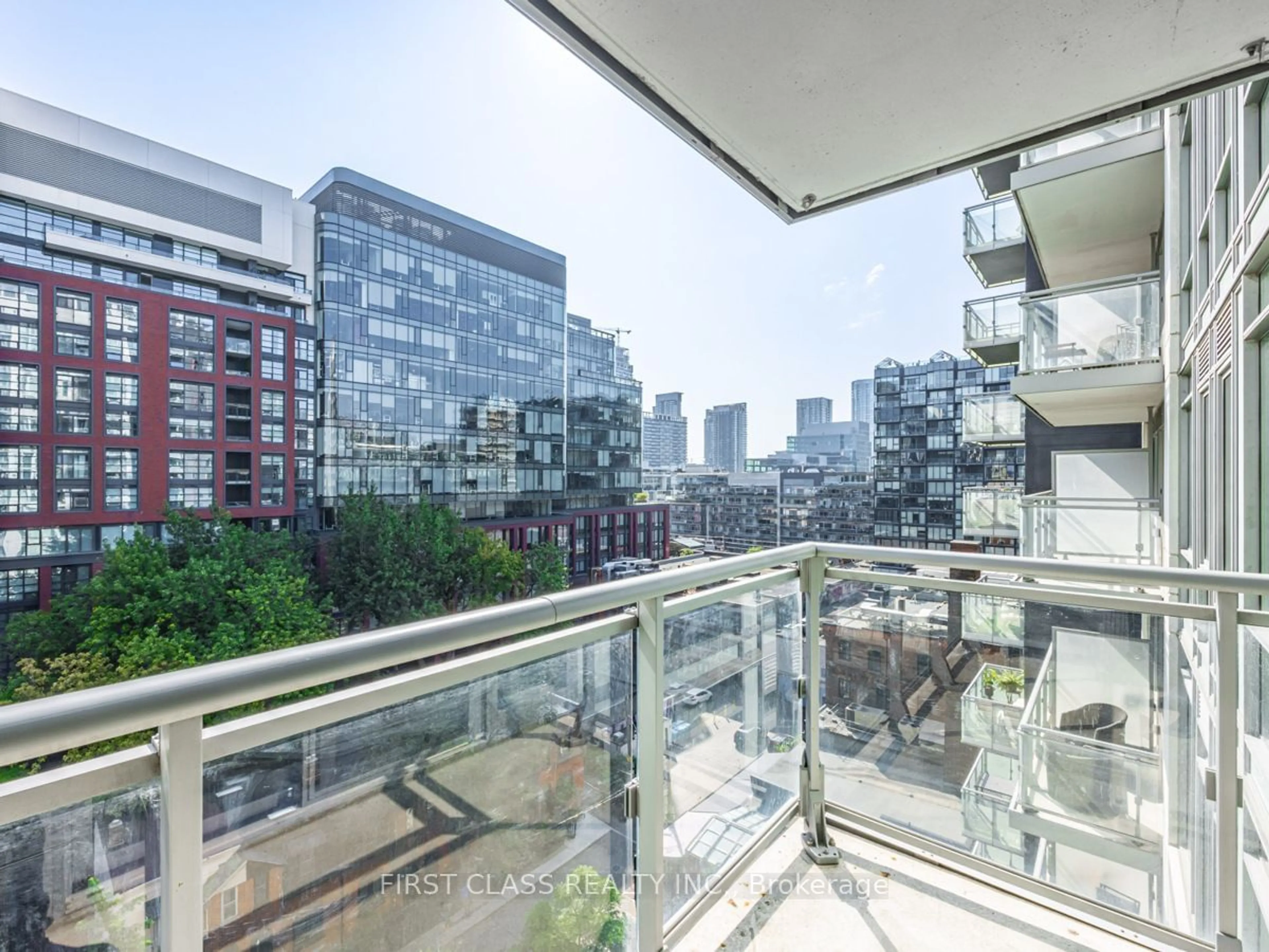 Balcony in the apartment, city buildings view from balcony for 525 Adelaide St #1022, Toronto Ontario M5V 0N7