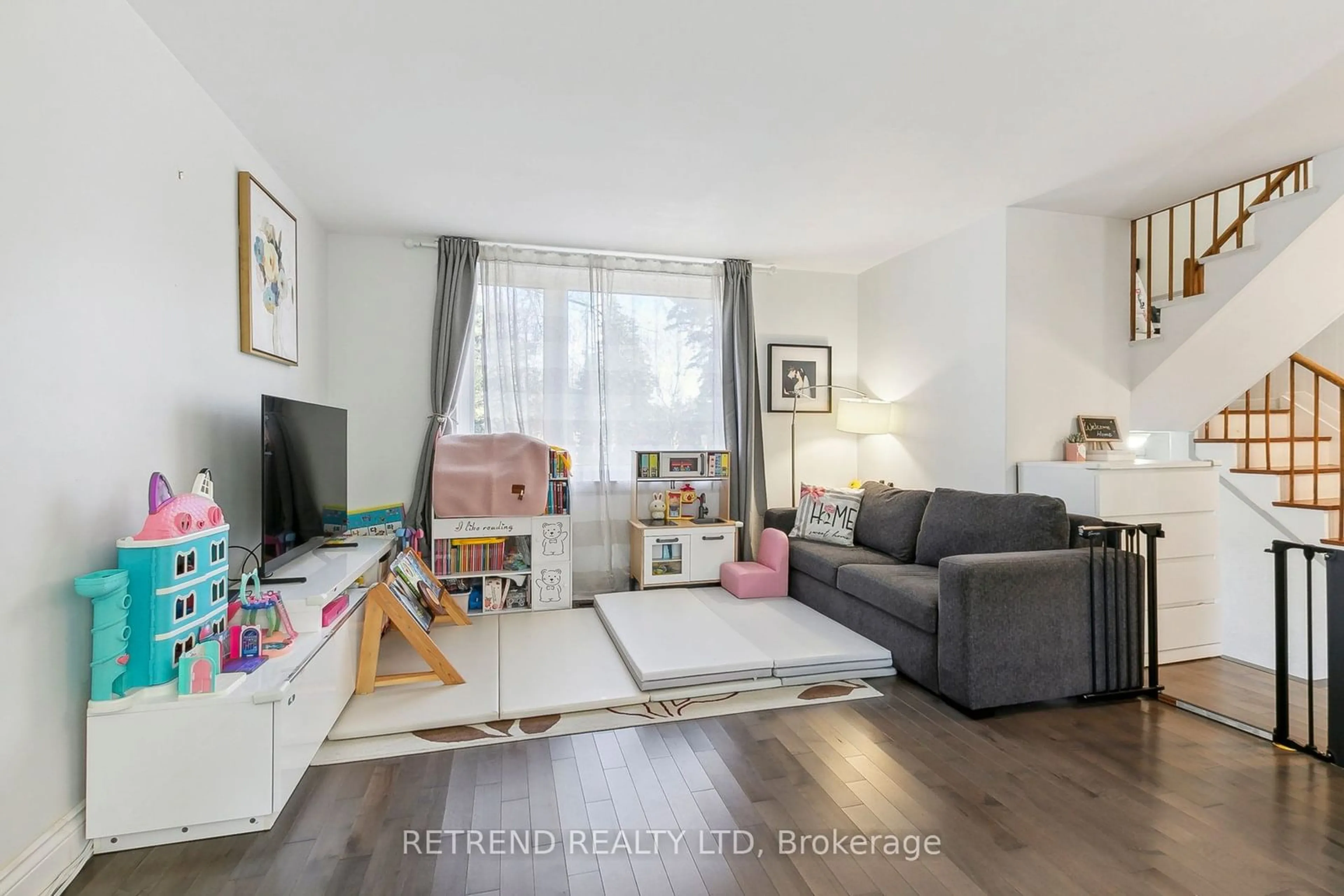 Living room with furniture, wood/laminate floor for 58 Broadpath Rd, Toronto Ontario M3C 2B5