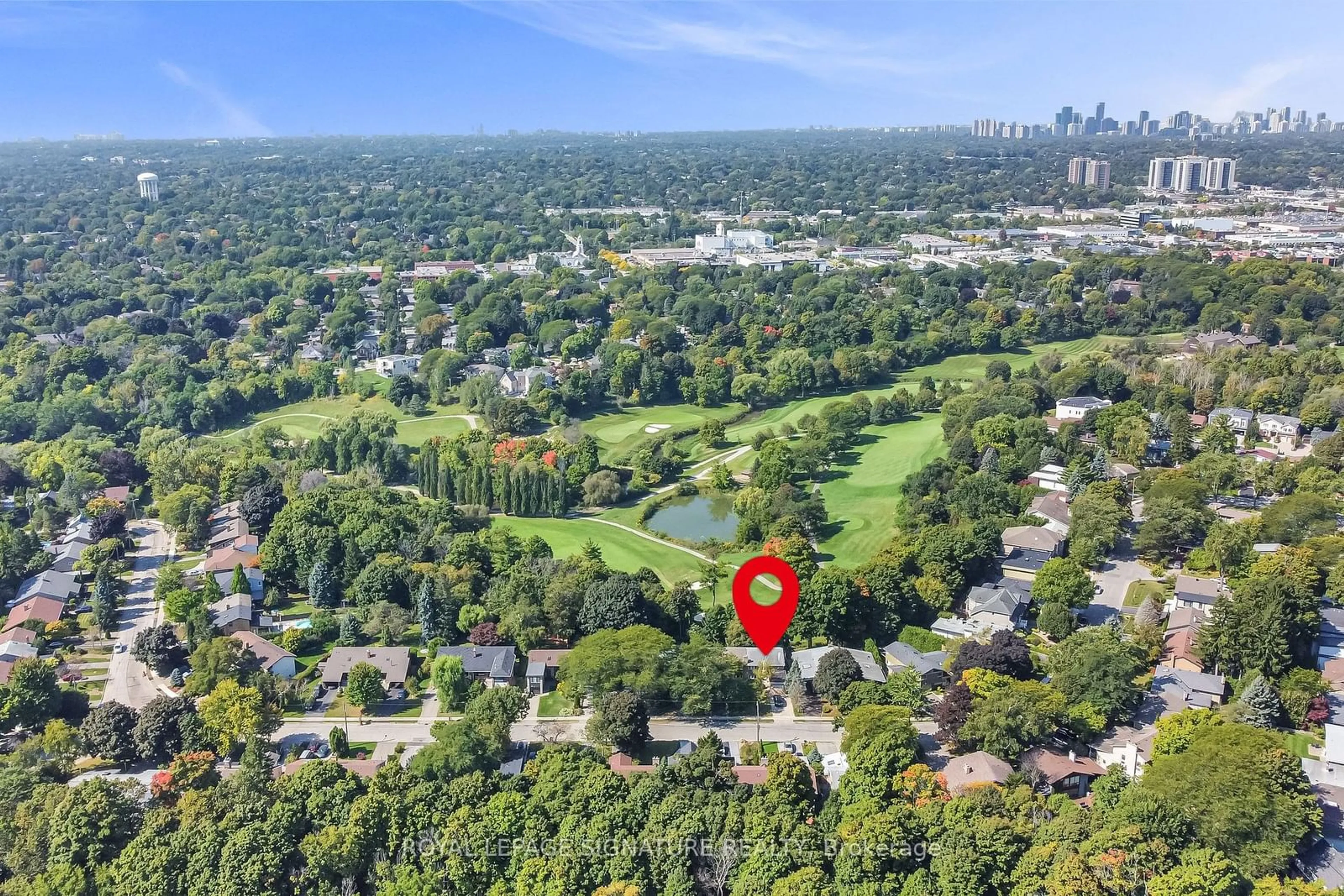 A pic from outside/outdoor area/front of a property/back of a property/a pic from drone, forest/trees view for 130 Three Valleys Dr, Toronto Ontario M3A 3B9