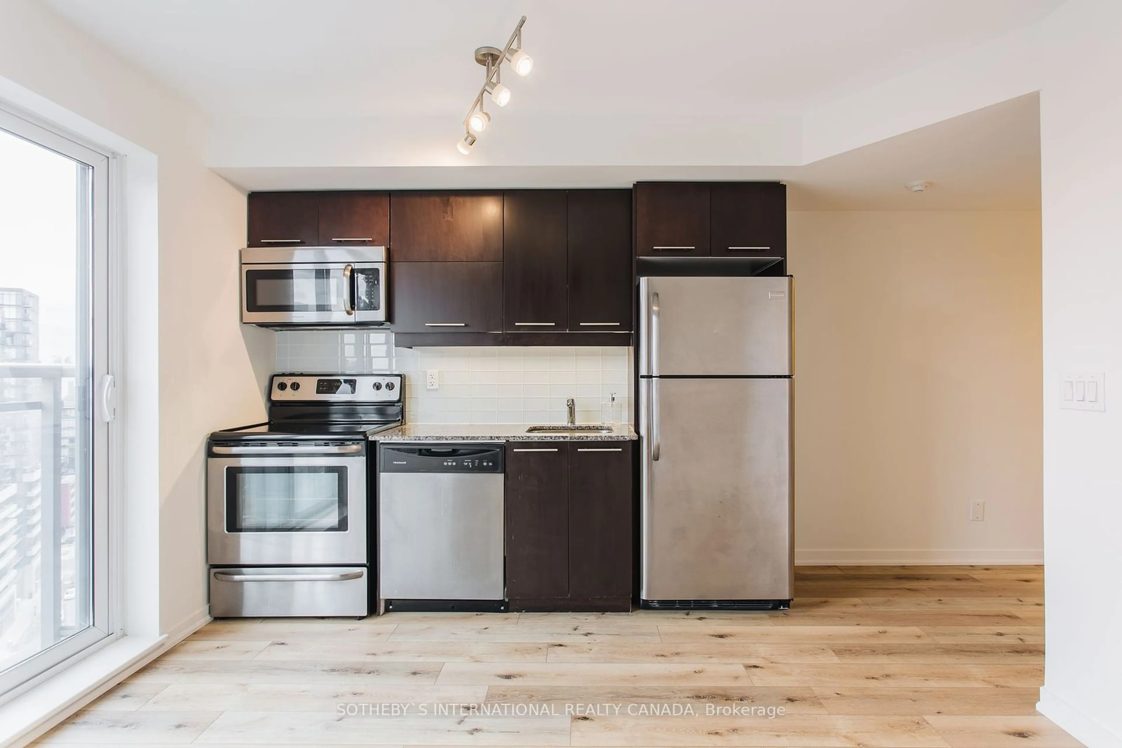 Standard kitchen, wood/laminate floor for 38 Joe Shuster Way #1619, Toronto Ontario M6K 0A5