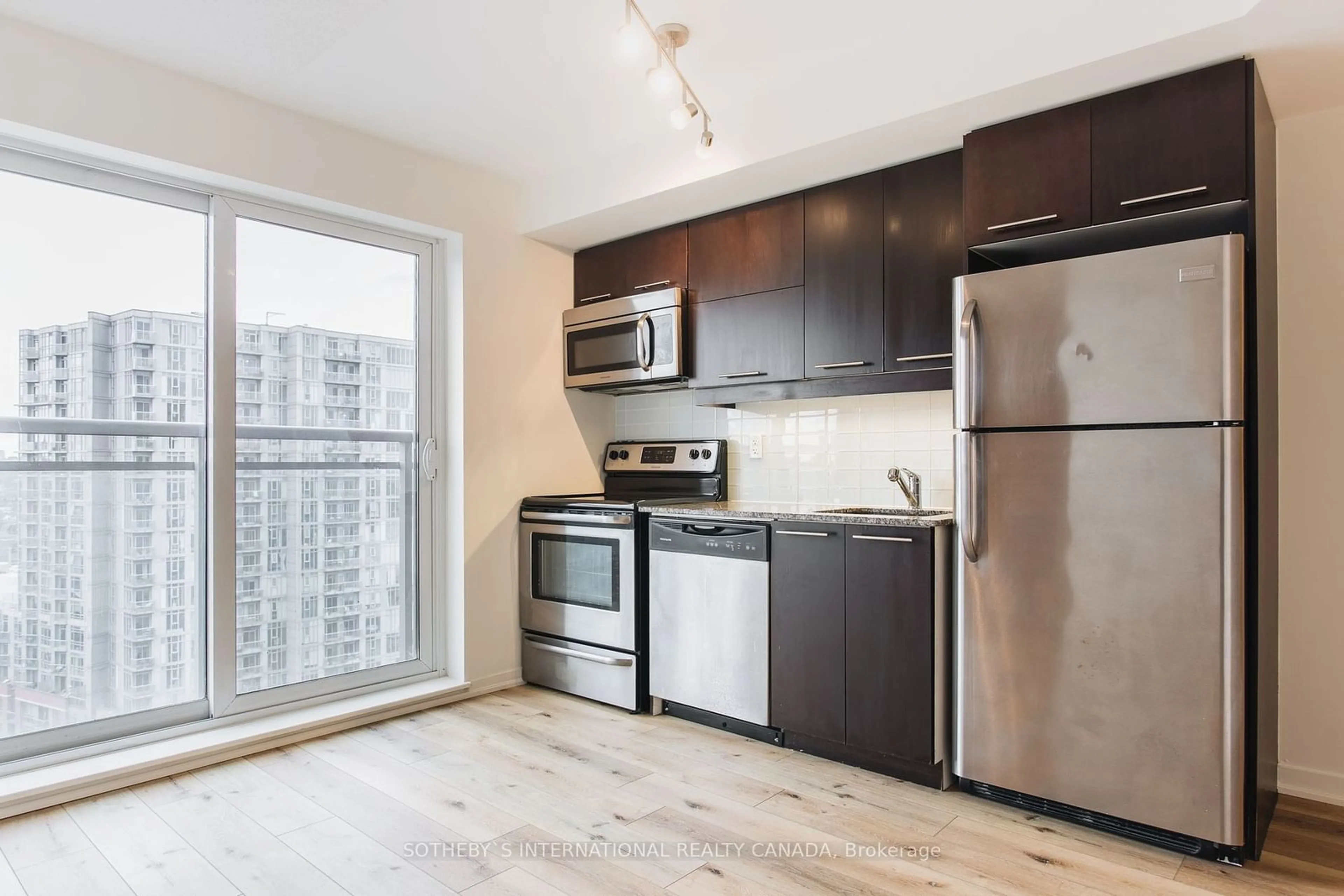 Standard kitchen, wood/laminate floor for 38 Joe Shuster Way #1619, Toronto Ontario M6K 0A5