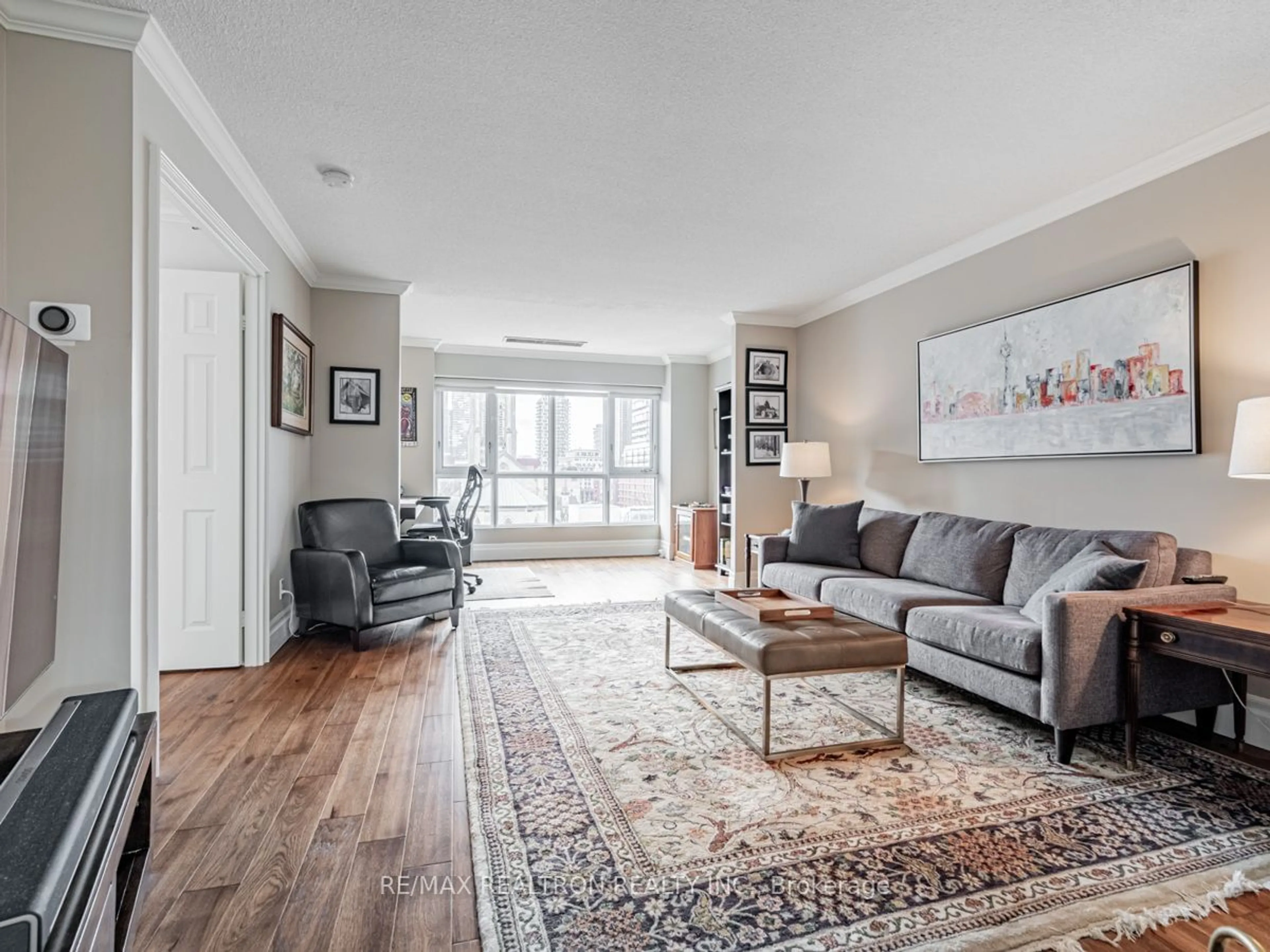 Living room with furniture, wood/laminate floor for 55 Lombard St #613, Toronto Ontario M5C 2R7