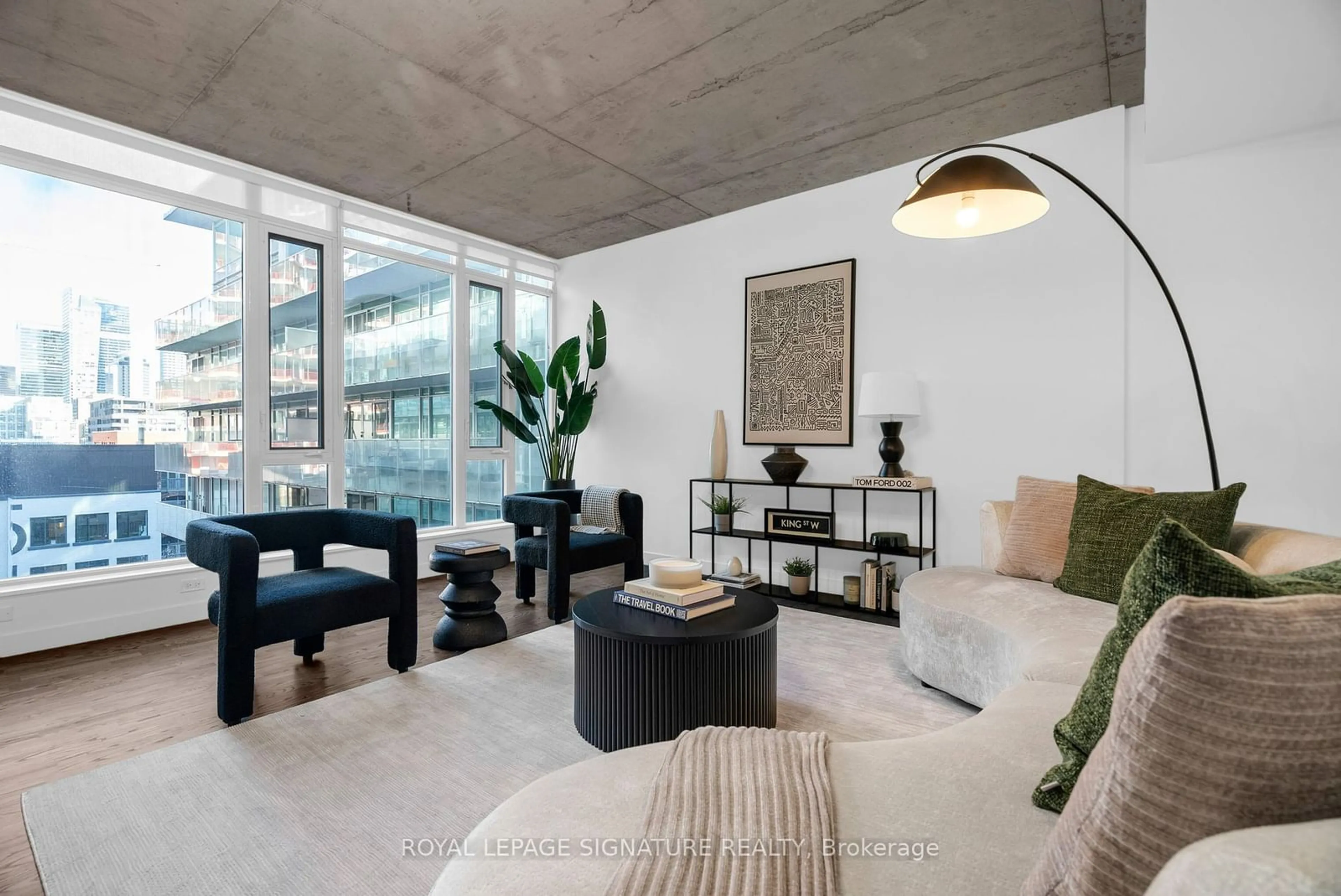 Living room with furniture, cement floor for 75 Portland St #809, Toronto Ontario M5V 2M9